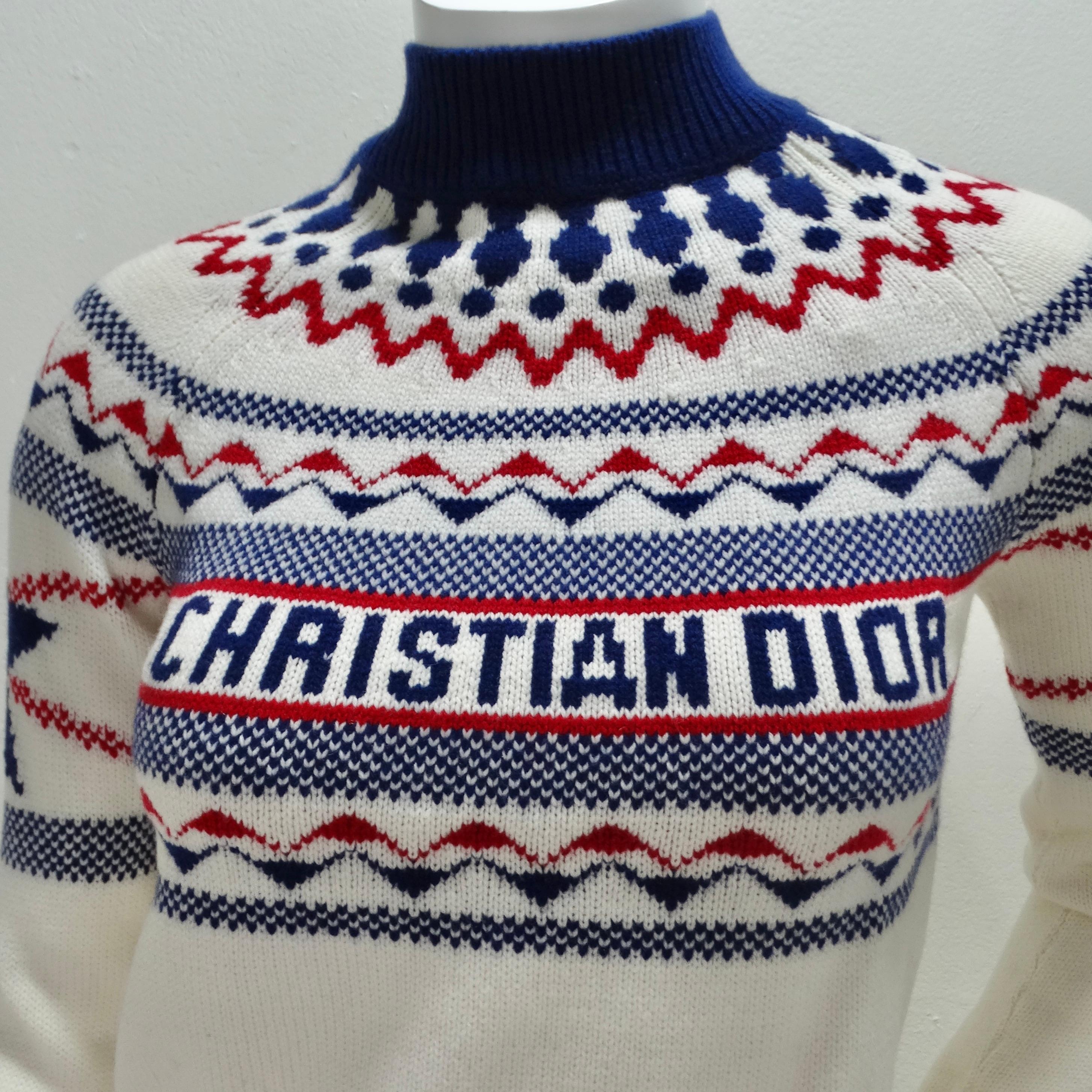 Experience the epitome of luxury with the Christian Dior Cashmere Knit Sweater. Crafted from a blend of 70% wool and 30% cashmere, this white knit sweater envelops you in warmth and comfort. The navy and red stripes, accompanied by navy stars on the