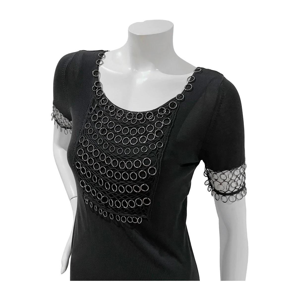Chainmail Knit Dress by John Galliano for Dior  
Spring/Summer 2007
Made in Italy 
Black 
Short sleeves 
Knee-length 
Loose, flowy fit 
Silver metal chainmail detail at collar, bust, sleeve hem and bottom hem
Tank dress lining layer
100% cotton 