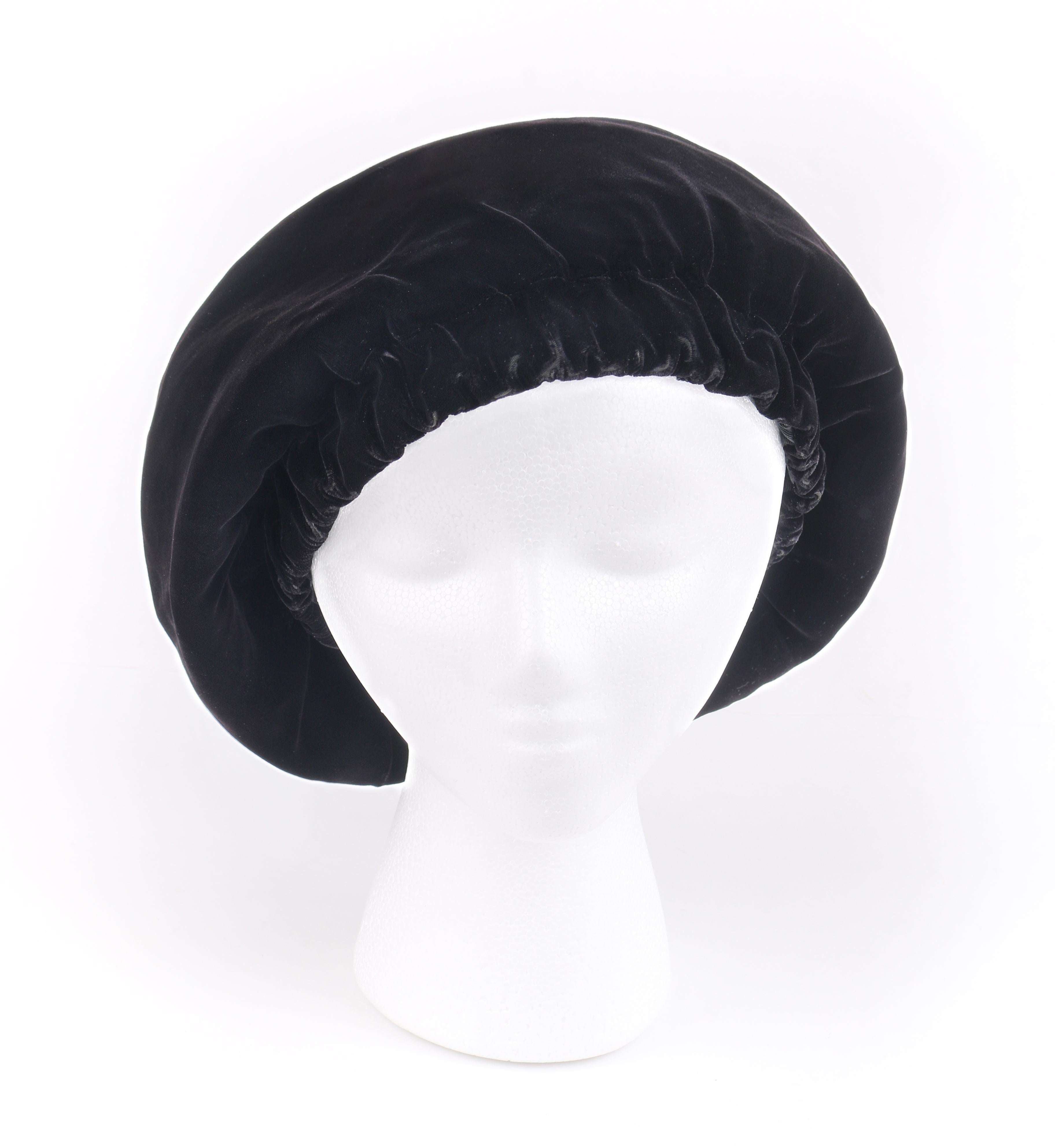 CHRISTIAN DIOR Chapeaux c.1960’s Marc Bohan Black Gathered Velvet Beret Hat
 
Circa: 1960’s
Labels: Christian Dior / Chapeaux / Paris - New York 
Designer: Marc Bohan
Style: Beret 
Color(s): Black
Lined: Yes 
Unmarked Fabric Content (feel of):