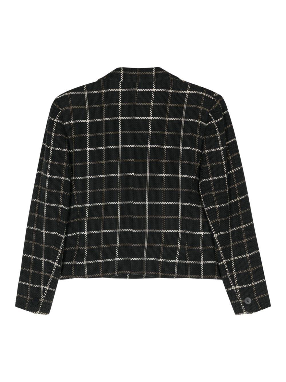 Christian Dior Kastenjacke mit Karomuster aus den 1990er Jahren mit folgenden Eigenschaften: Interlock-Gewebe, Karomuster, gekerbtes Revers, lange Ärmel mit geknöpften Manschetten, Brustleistentasche, zwei seitliche Pattentaschen, gerader Saum,