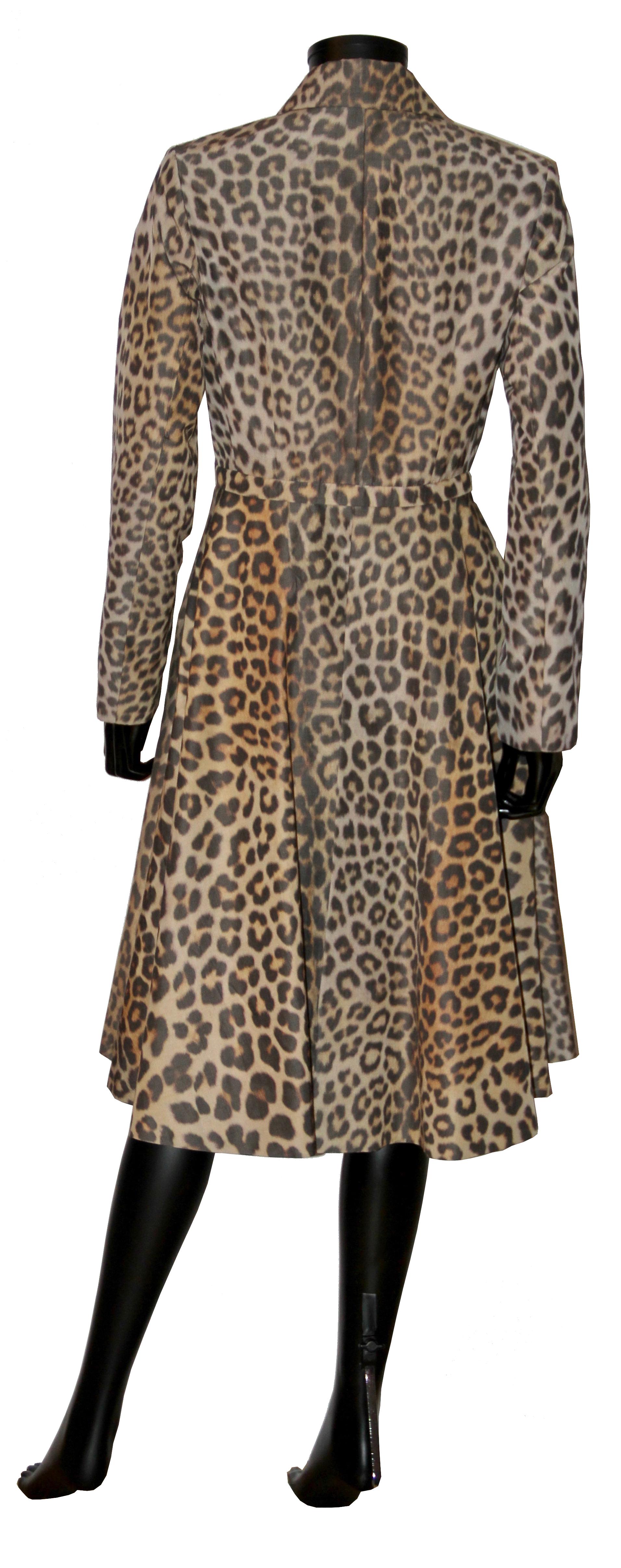 This very attractive animal print coat from Christian Dior can be worn as well as a jacket by unzipping the bottom part.
The waist is fitted giving it a 