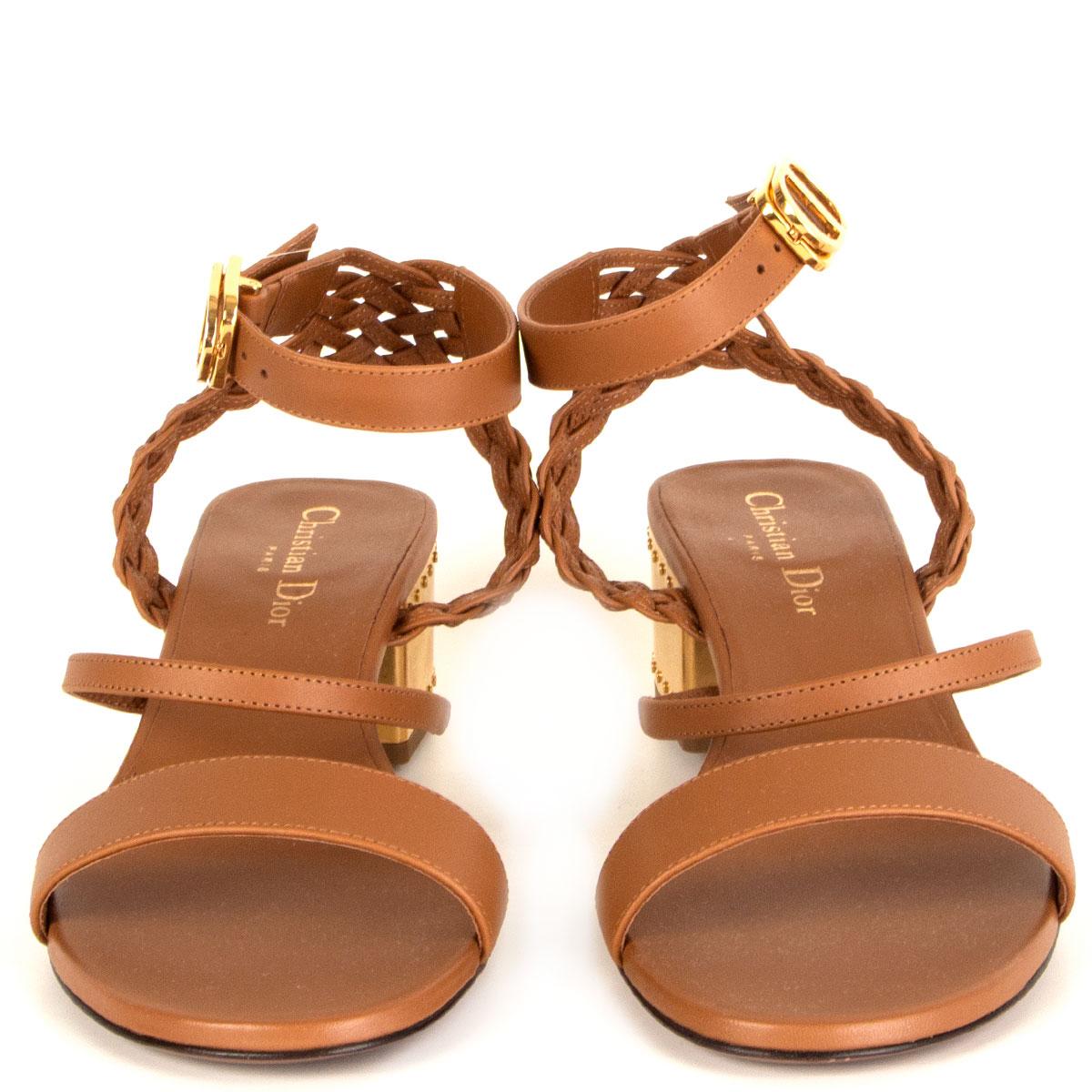 100% authentic Christian Dior Égéé ankle-strap block-heel sandals in cognac brown calfskin embellished with a braided detail on the back, gold-tone metal heel and CD buckle closure. Brand new. Come with dust bag. 

Measurements
Imprinted