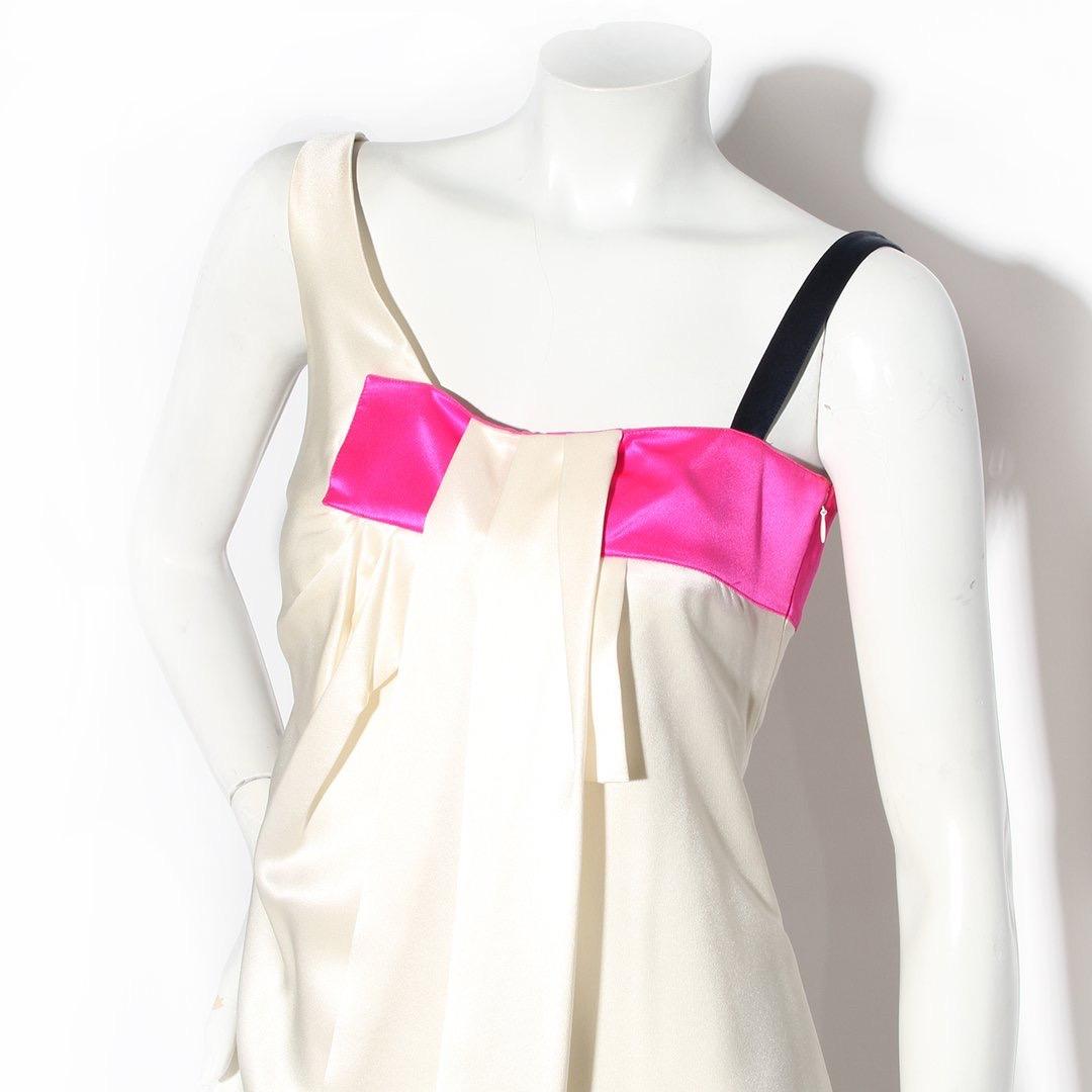 Christian Dior Color Block Dress
Made in France 
100% Silk
Ivory sheath dress
Hot pink color block square at top of dress
Navy blue left strap
Three knife pleat detail at bust of dress
Invisible zipper in left side of dress with hook and eye closure