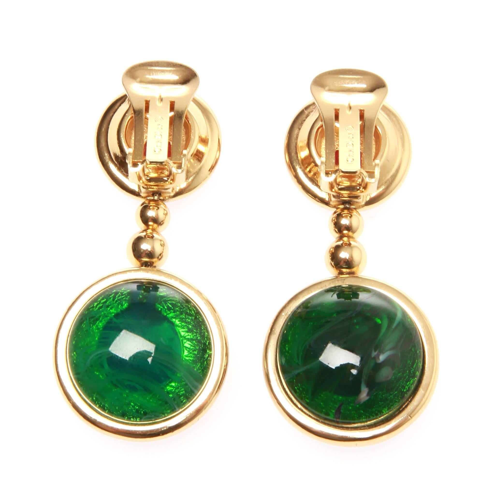 	
Christian Dior drop earrings. 

An eye catching vintage pair of Christian Dior colour earrings you won't want to miss.

Gold tone setting with red, blue and green ton coloured glass stones.

Features: Clip on