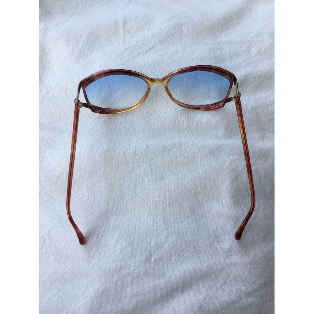 Christian Dior Copper Frame Oversized Sunglasses in Brown

Christian Dior glasses. Copper frame with gold details. 
 The lenses are clear, with a shade of blue tones. 
 They measure 13.5 cm X 5 cm. 
 Good general condition, with signs of normal
