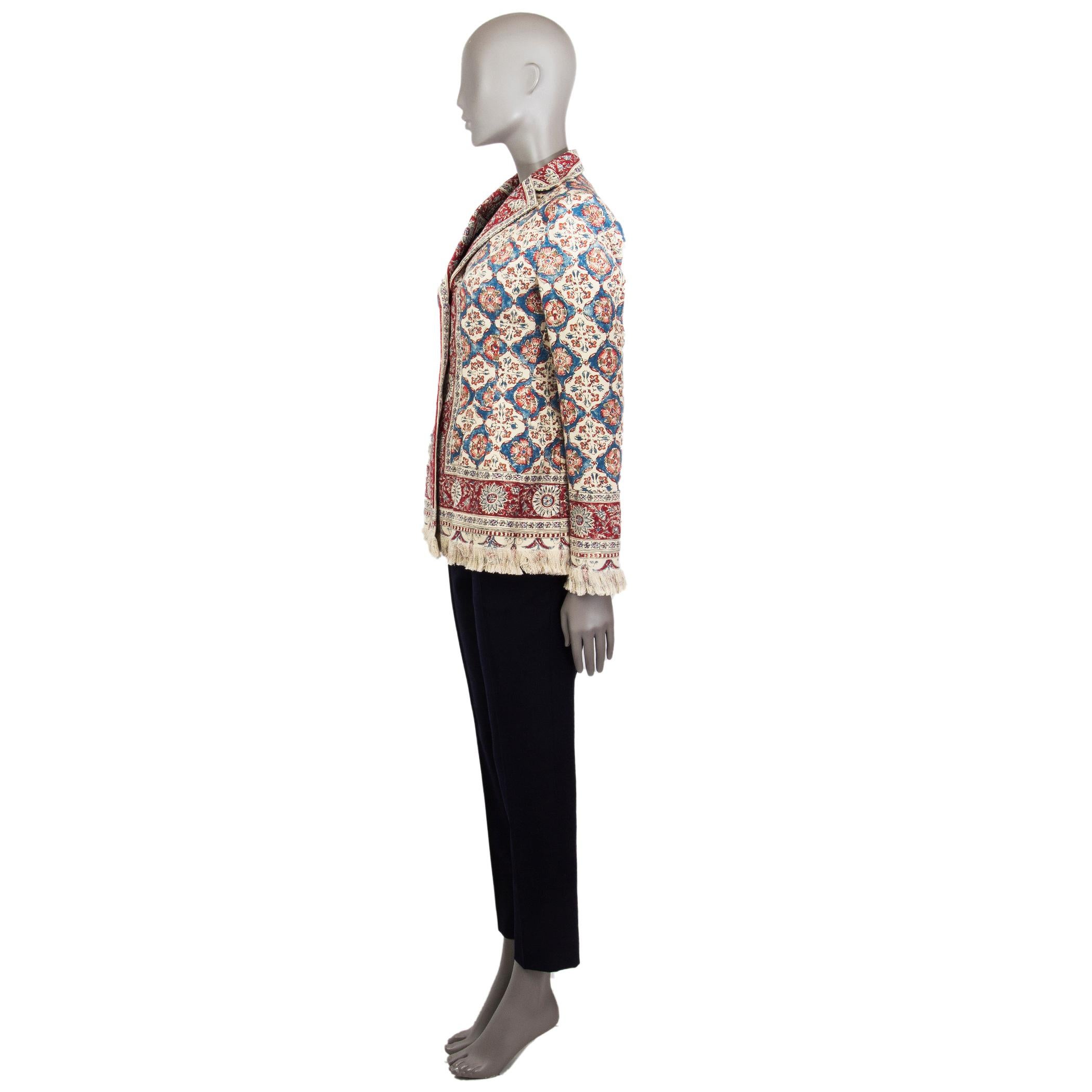 Christian Dion oriental print blazer in cherry red, red, aegean blue, charcoal, sand, brown-beige linen (100%) with a step collar, single breasted, two open pockets. Buttoned cuffs, fringed hemline and sleeves. Closes with buttons in the front.