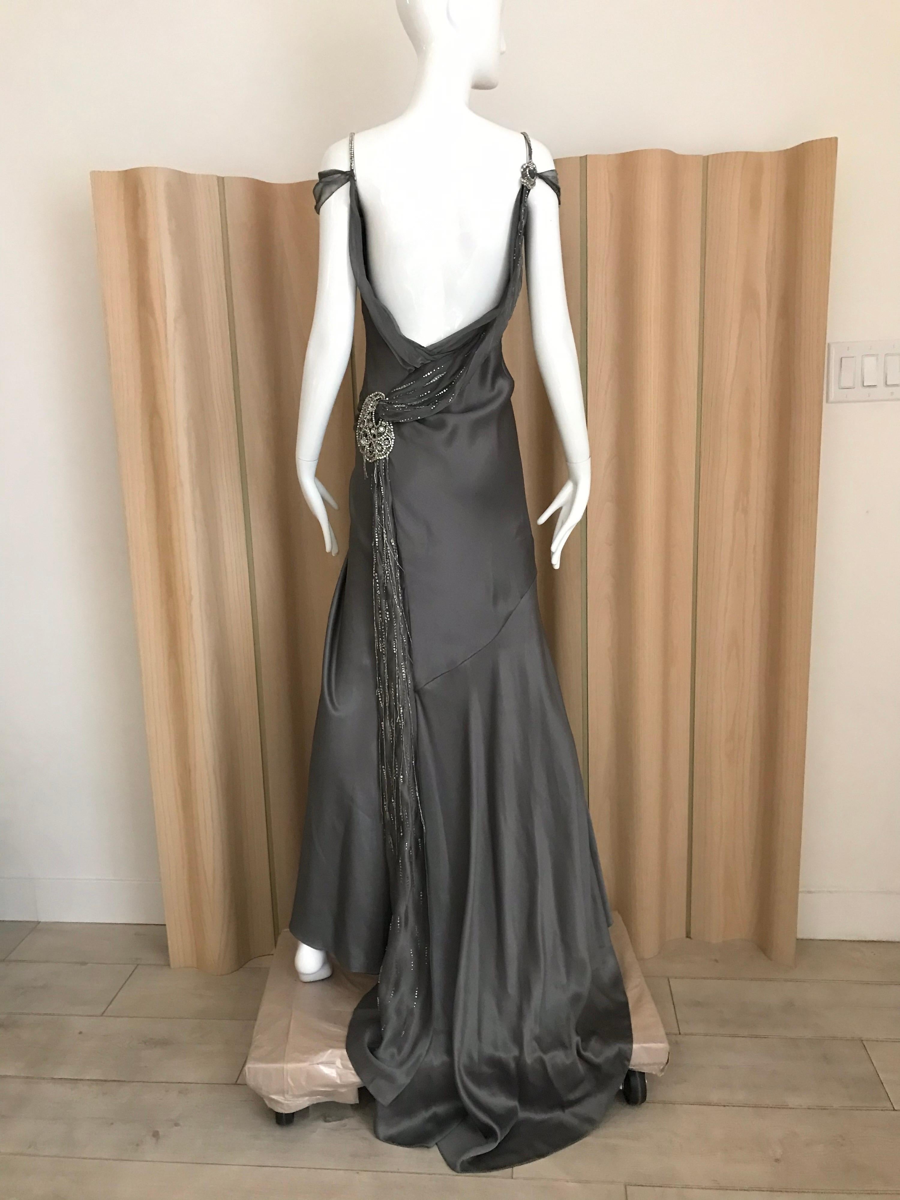 Christian Dior Couture by John Galliano Grey Silk Gown with draped at the back. 
Fit size US 4