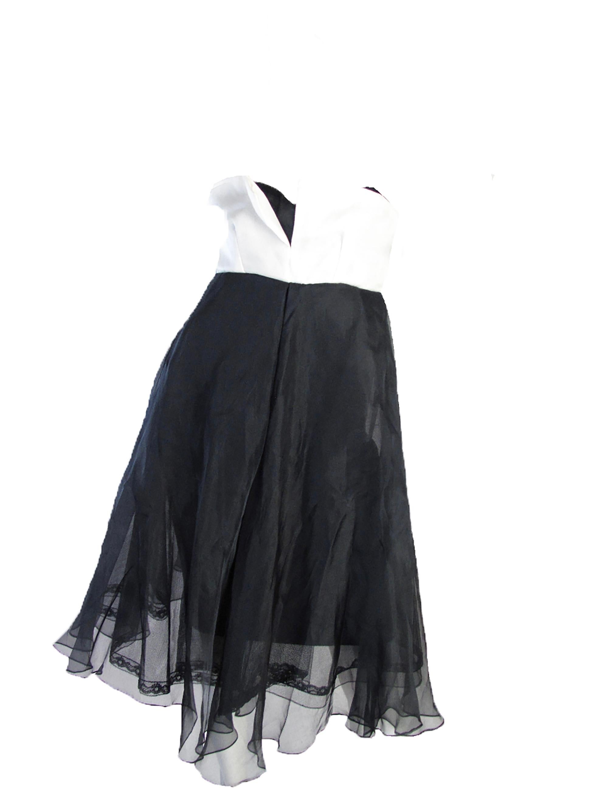 Christian Dior Couture strapless tuxedo dress. 
Condition: Very good. Sz 4
