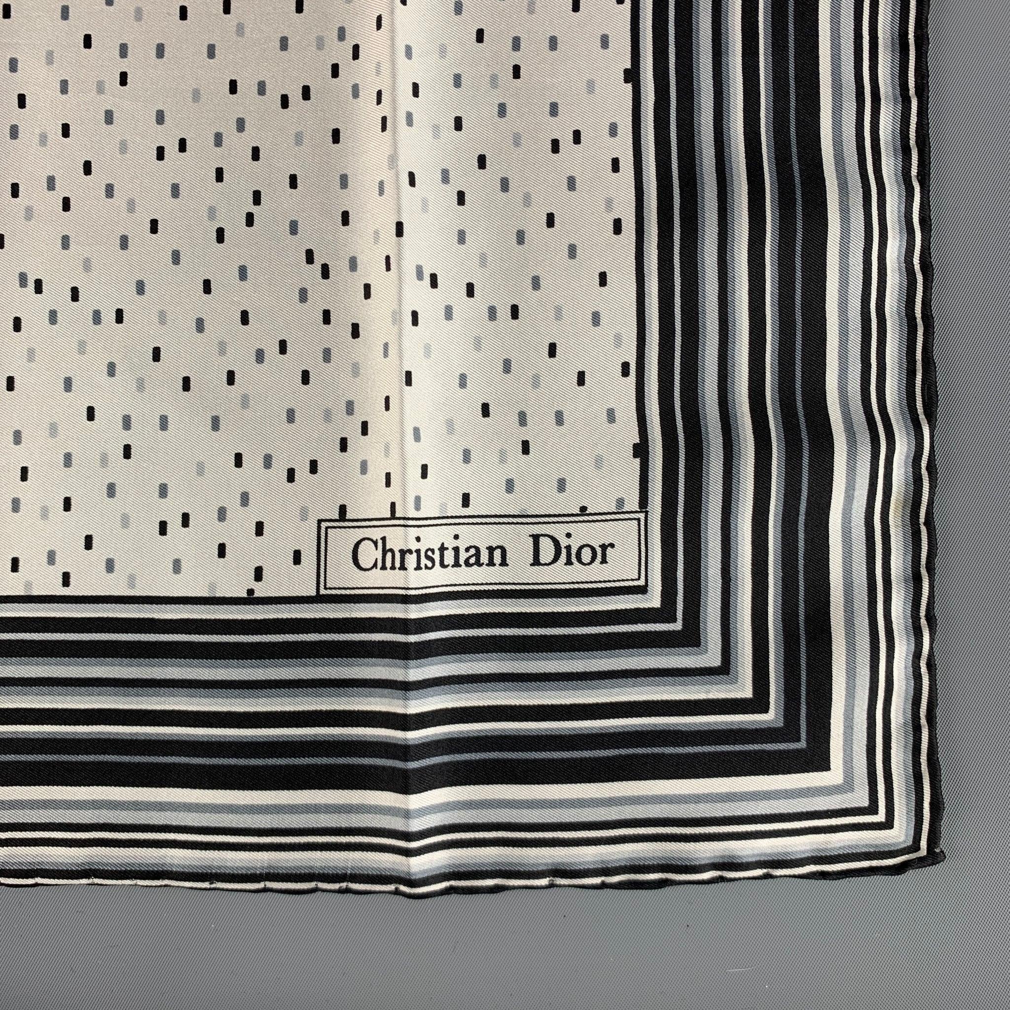 CHRISTIAN DIOR pocket square comes in cream with black stripes & dots, featuring a hand rolled hem.
Excellent Pre-Owned Condition. 

Measurements: 
   18 inches  x 18 inches 

  
  
 
Reference: 125447
Category: Pocket Square
More Details
   