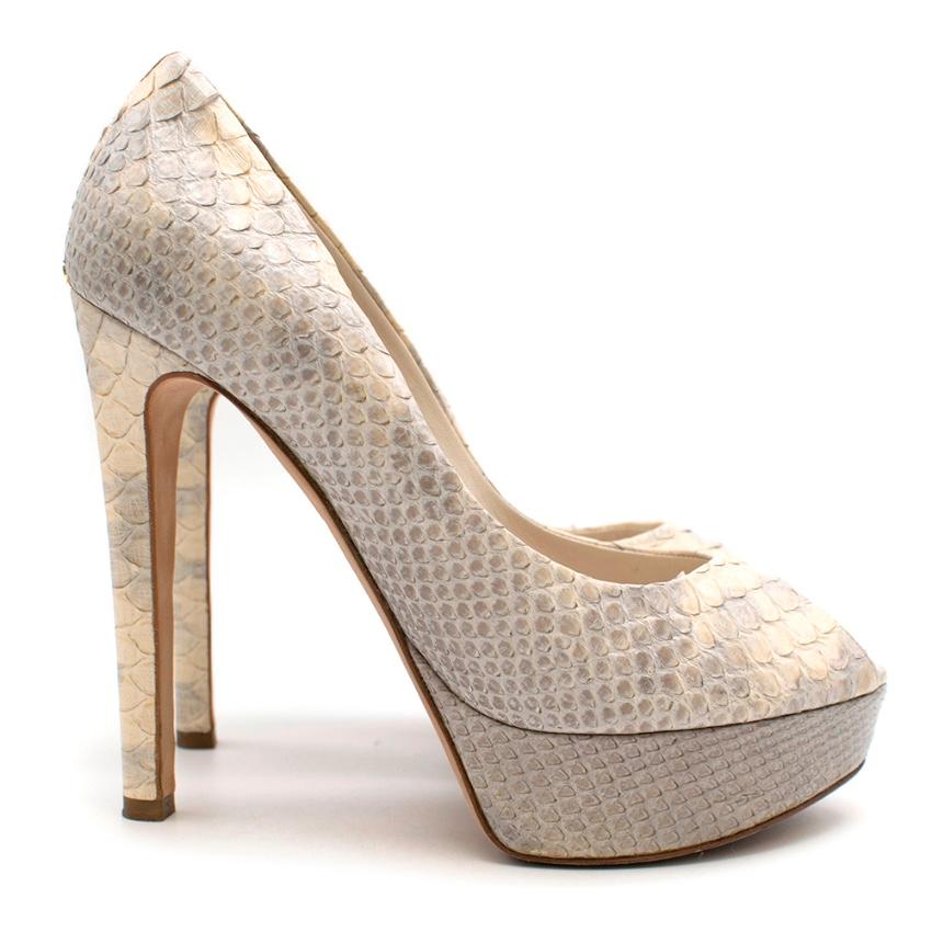 Christian Dior - Cream Python Platform Heels

- peep toe
- platform 
- stiletto heel
- two tone cream and grey python leather
- gold CD embellishment at the heel 

- 100% leather
- made in Italy

Approx in CM

Width - 7cm
Platform - 3cm
Heel -