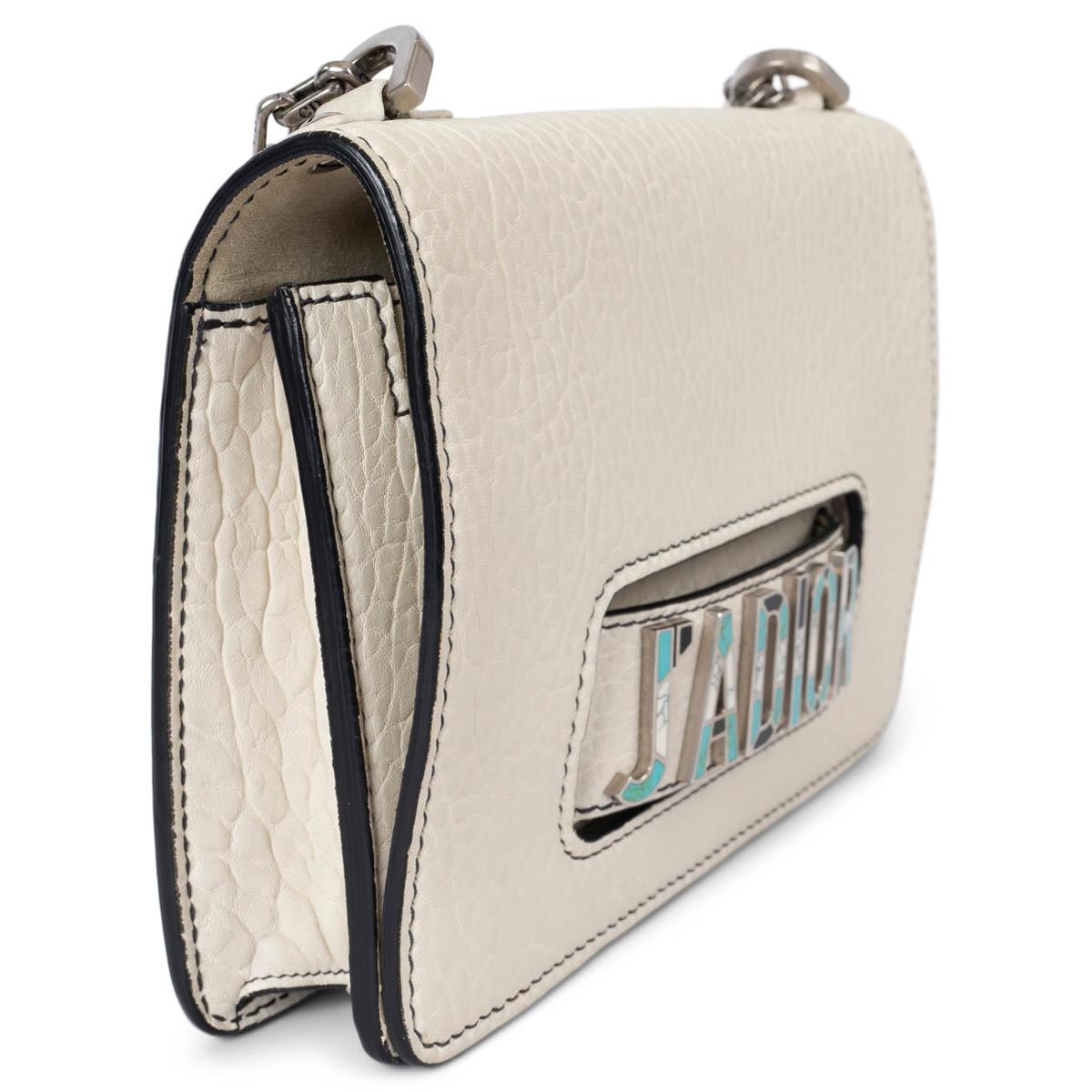 100% authentic Christian Dior J'Adior Small flap shoulder bag in cream Canyon grained lambskin leather. Features a chain strap and Mosaic logo. Features an open pocket on the front and the flap. Lined in leather with two open pockets against the