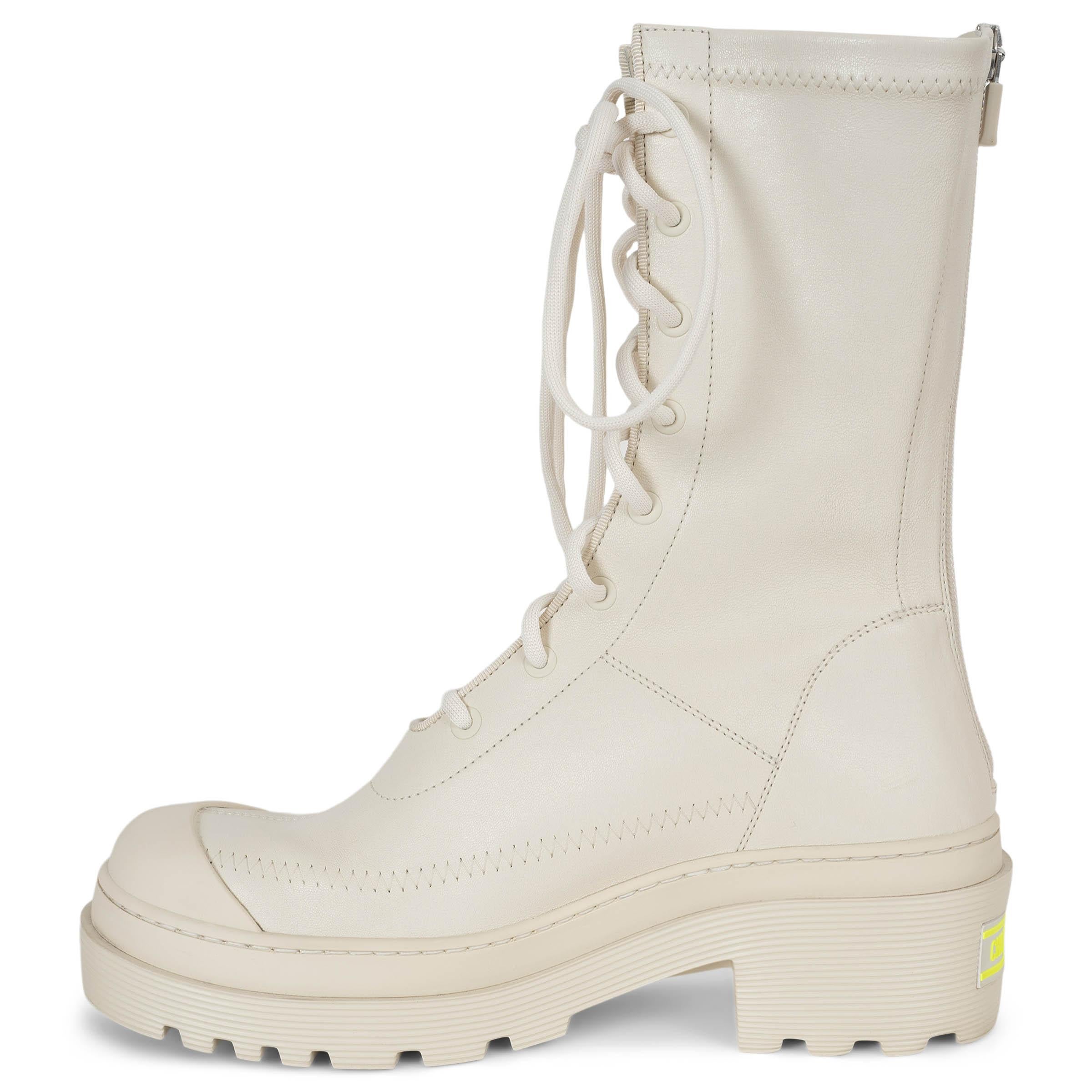 This 100% authentic Christian Dior Arcade combat boots in cream stretch lambskin leather blend bold design with modern craftsmanship. Featuring an open decorative lace-up front, rounded toes, and sturdy block heels accented with a neon yellow