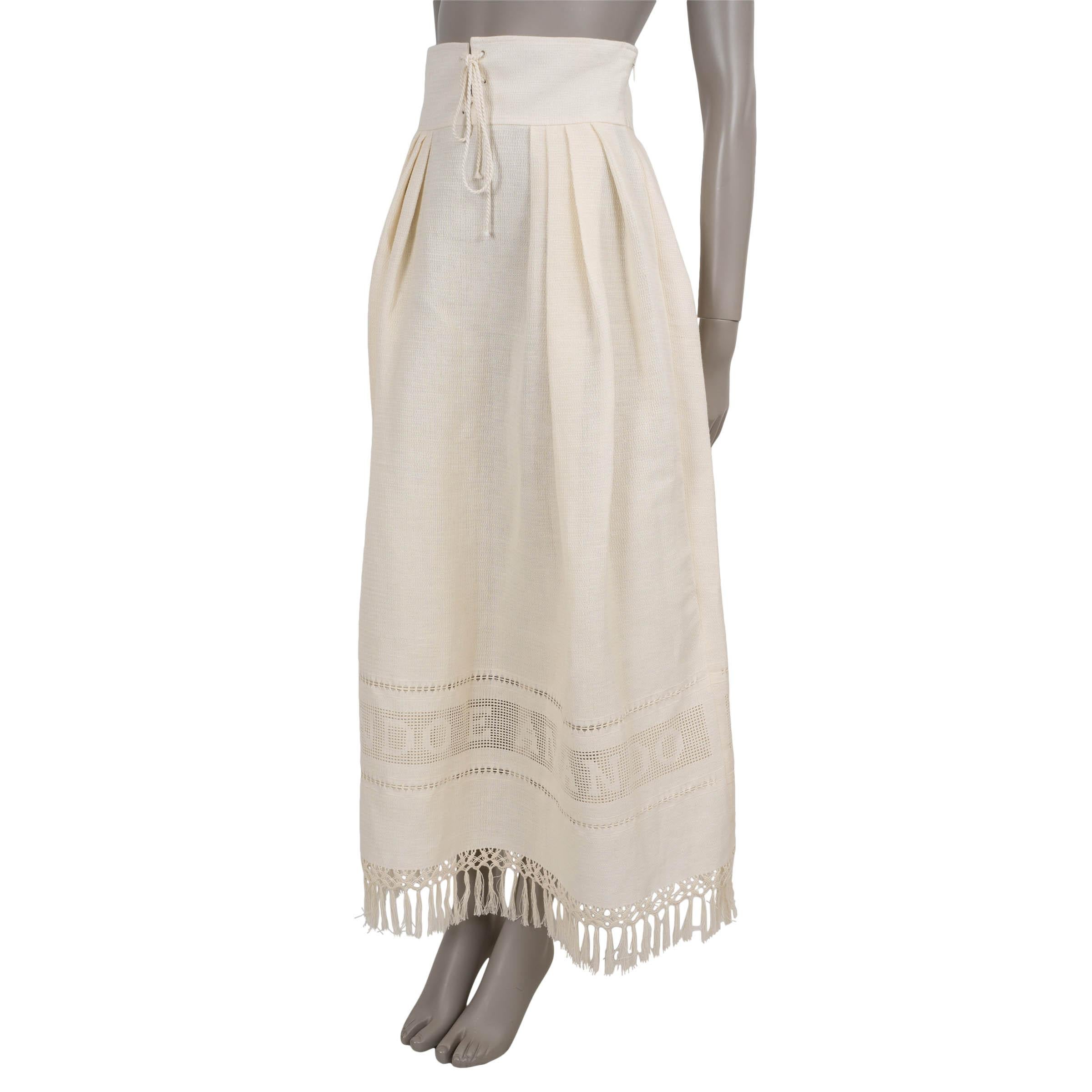 This 100% authentic Christian Dior skirt is crafted in cream textured woven cotton (50%) and linen (50%), offering a refined blend of structure and ease. The high-waisted, flared silhouette falls to a graceful maxi length, enhanced by pleating,