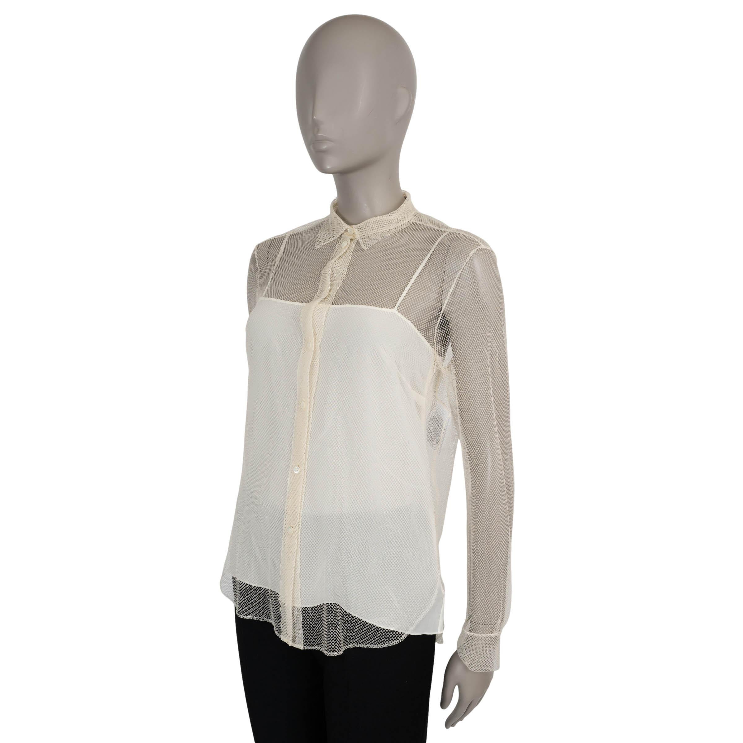 This 100% authentic Christian Dior button-up shirt in cream fishnet mesh polyamide (100%) offers a modern, airy take on a timeless classic. Featuring a structured point collar and buttoned cuffs, it closes with elegant mother-of-pearl buttons down