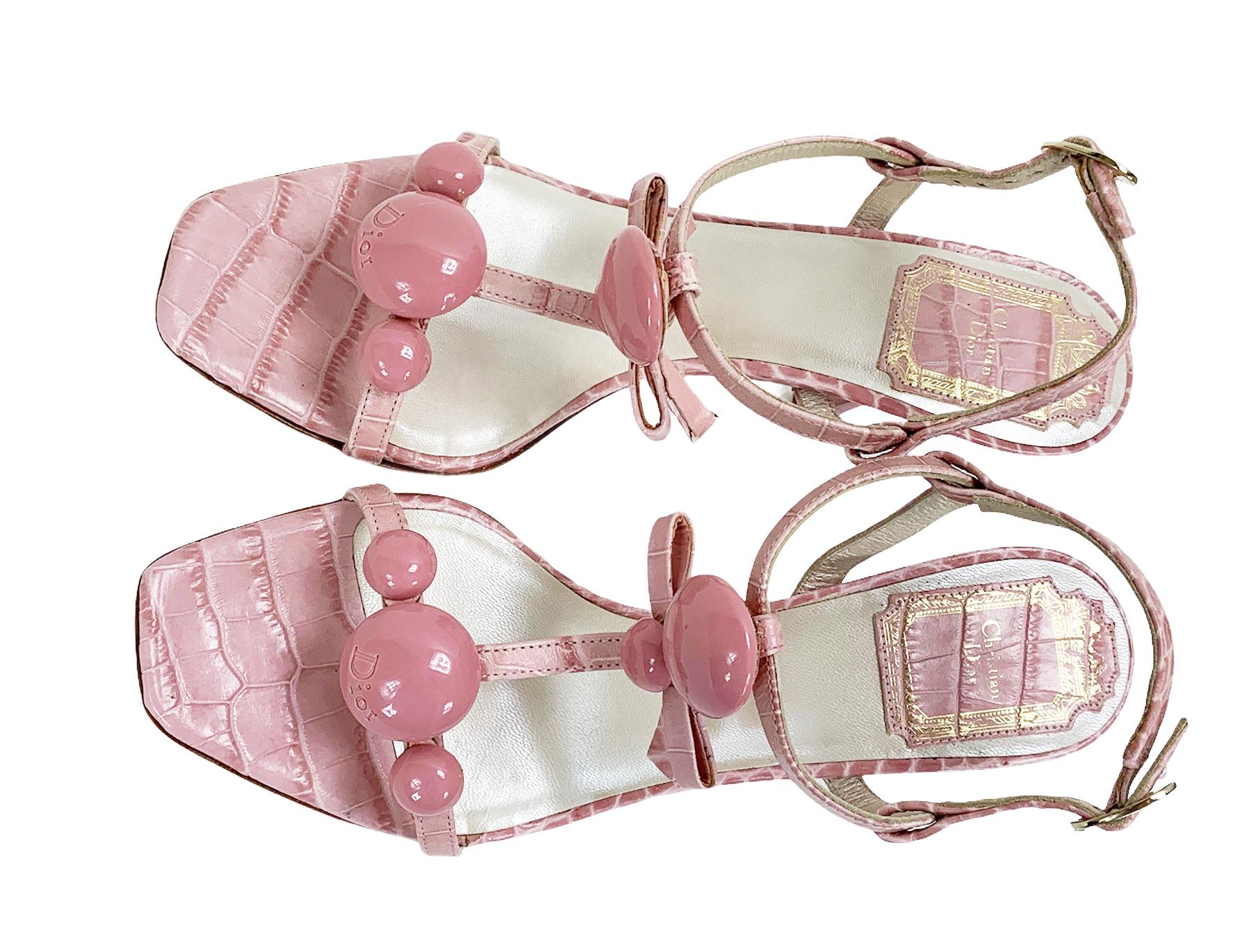 Christian Dior Crocodile Embossed T-Strap Shoes Slingback Sandals
Designer size 36 - US 6
Dusti Pink Color, Croc Embossed, Embellished, Bow Accent
Heel Height - 3 inches.
Made in Italy.
No original box, display model.