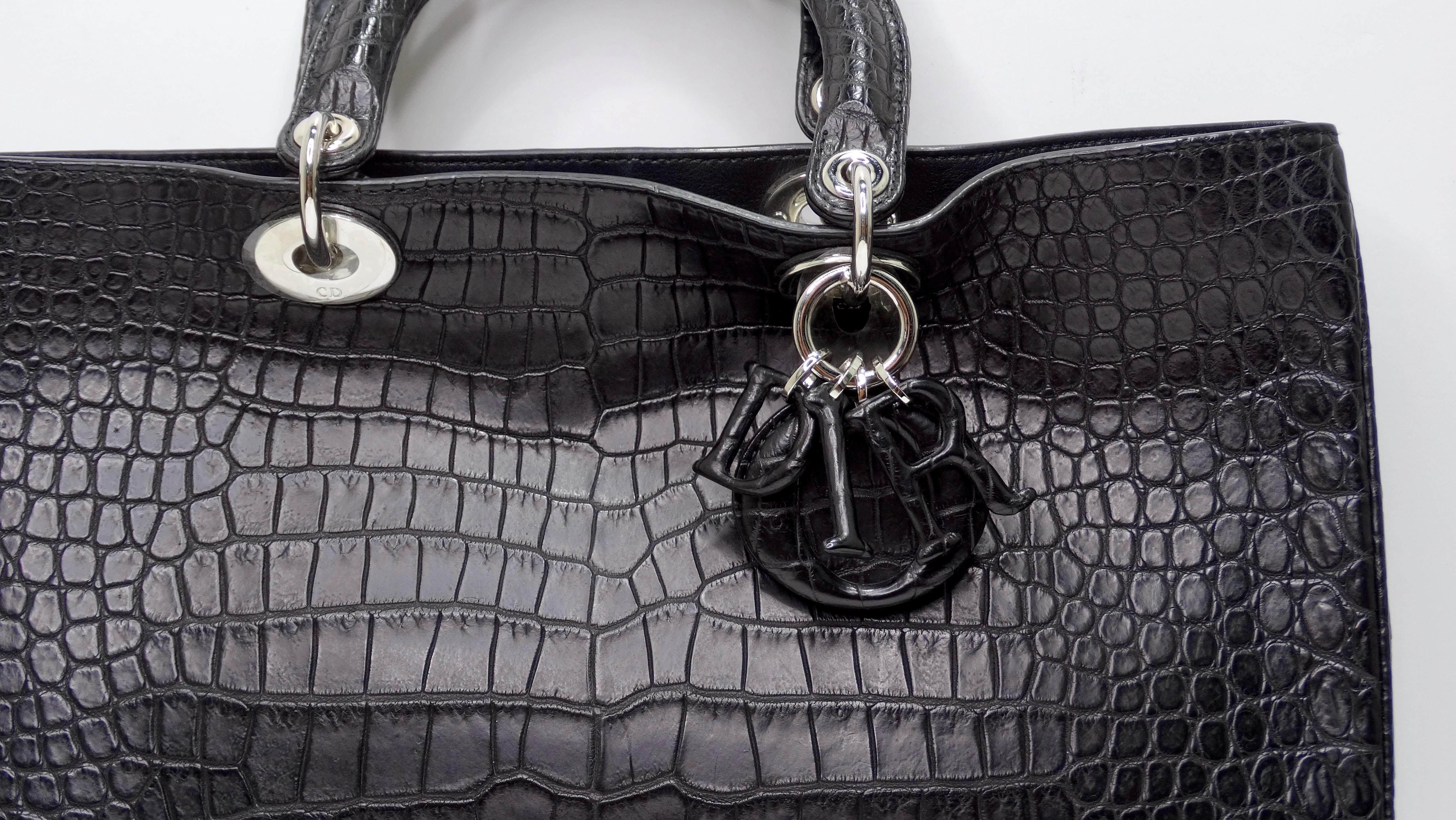 FOUND! A beautifully unique and rare Lady Dior! A timeless and significant design define this impeccable Lady Dior tote. An iconic creation, this tote brings eternal poise, gracefulness, and elegance to your appearance. The crocodile leather adds