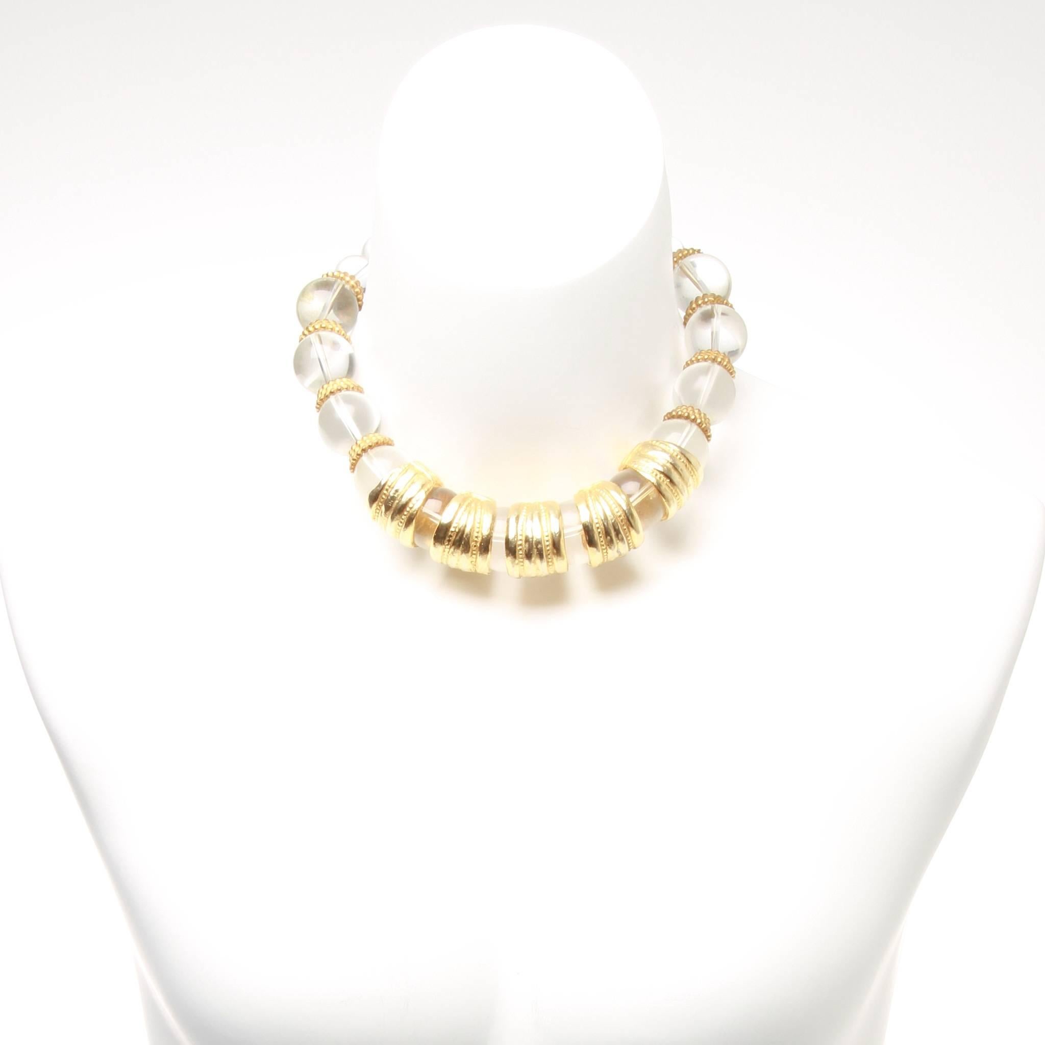 Beautiful Christian Dior tapered spherical crystal cocktail necklace with gold plated spacer beads.

Fastener: Spring ring closure with CD charm. 

Choker length