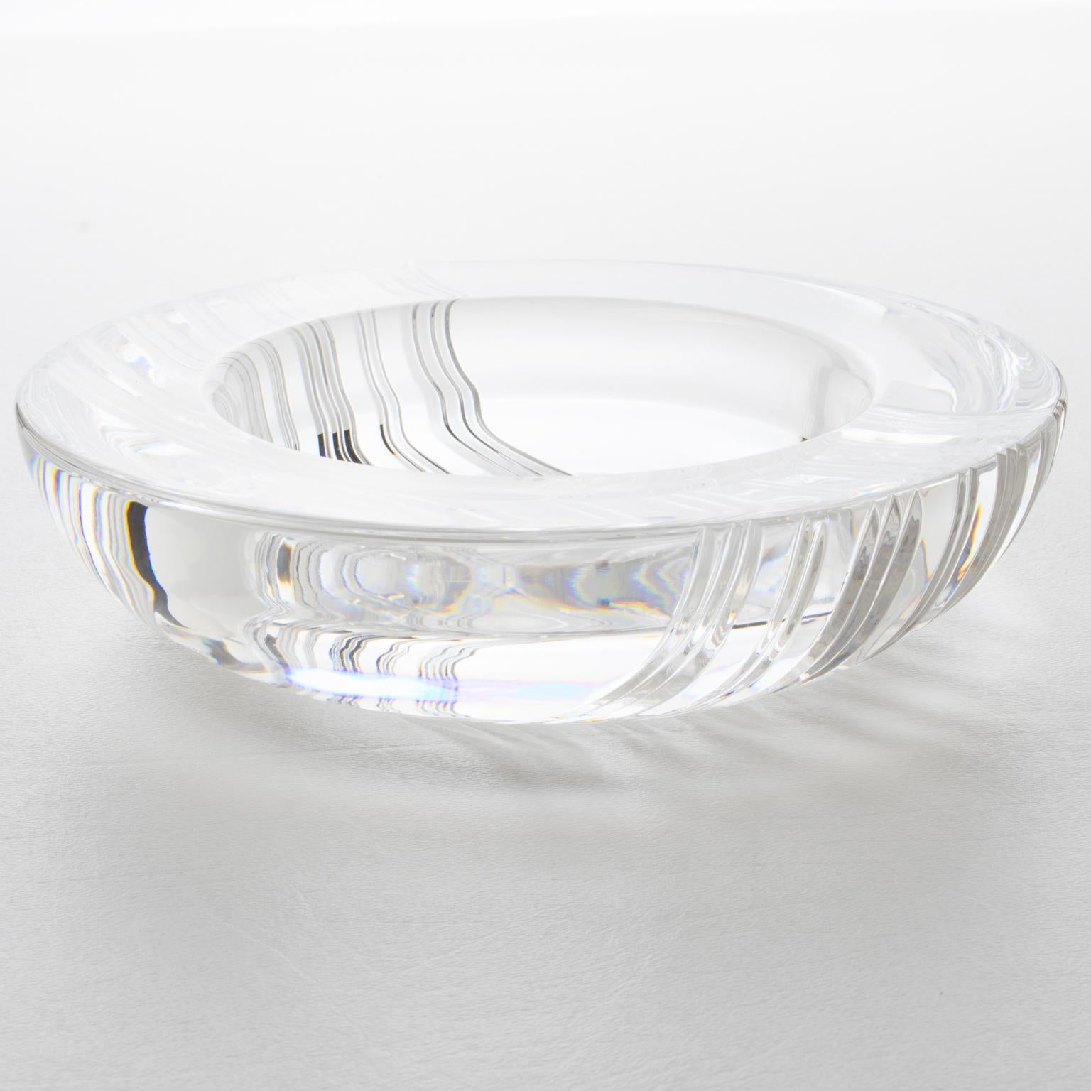 This exquisite Christian Dior crystal ashtray, or vide poche, is the perfect addition for a touch of luxury to any room. The intricate and heavily carved pattern is stunning, with alternating stripes around the bowl. It is marked with the 