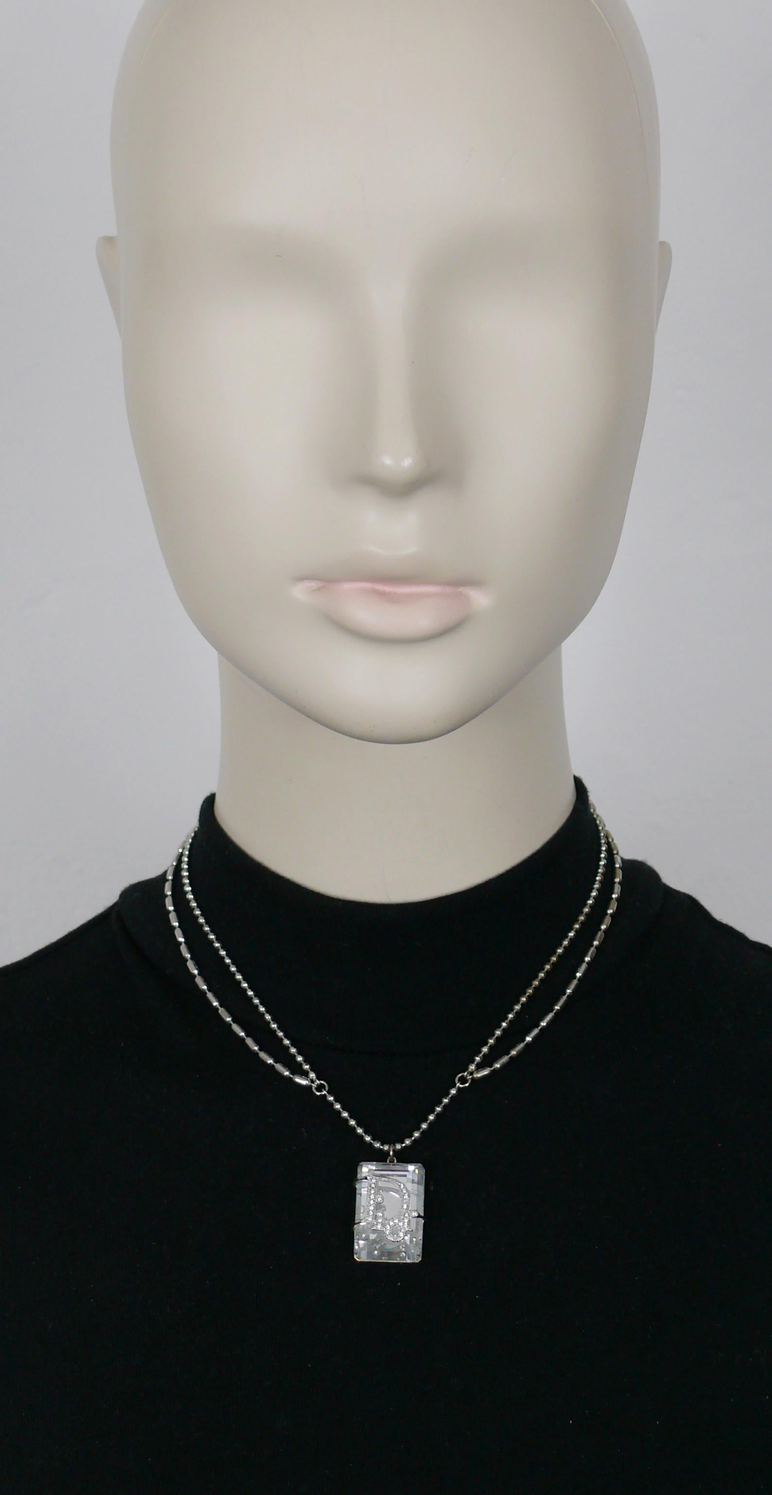 CHRISTIAN DIOR silver tone chain necklace featuring a large rectangular facetted clear crystal pendant encaged in a jewelled DIOR logo.

Adjustable lobster clasp closure.

Embossed DIOR.

Indicative measurements : adjustable length from approx. 38