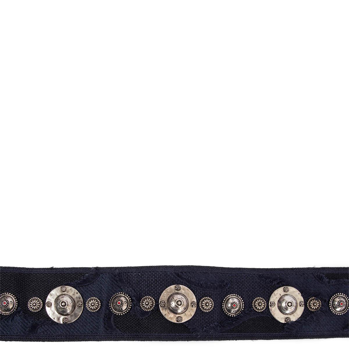 100% authentic Christian Dior Bohemian silver-tone studded metal emblems belt strap in shades of navy blue canvas featuring gold-tone clasps and black leather trimming. Has been carried and is in excellent condition. 

2020
