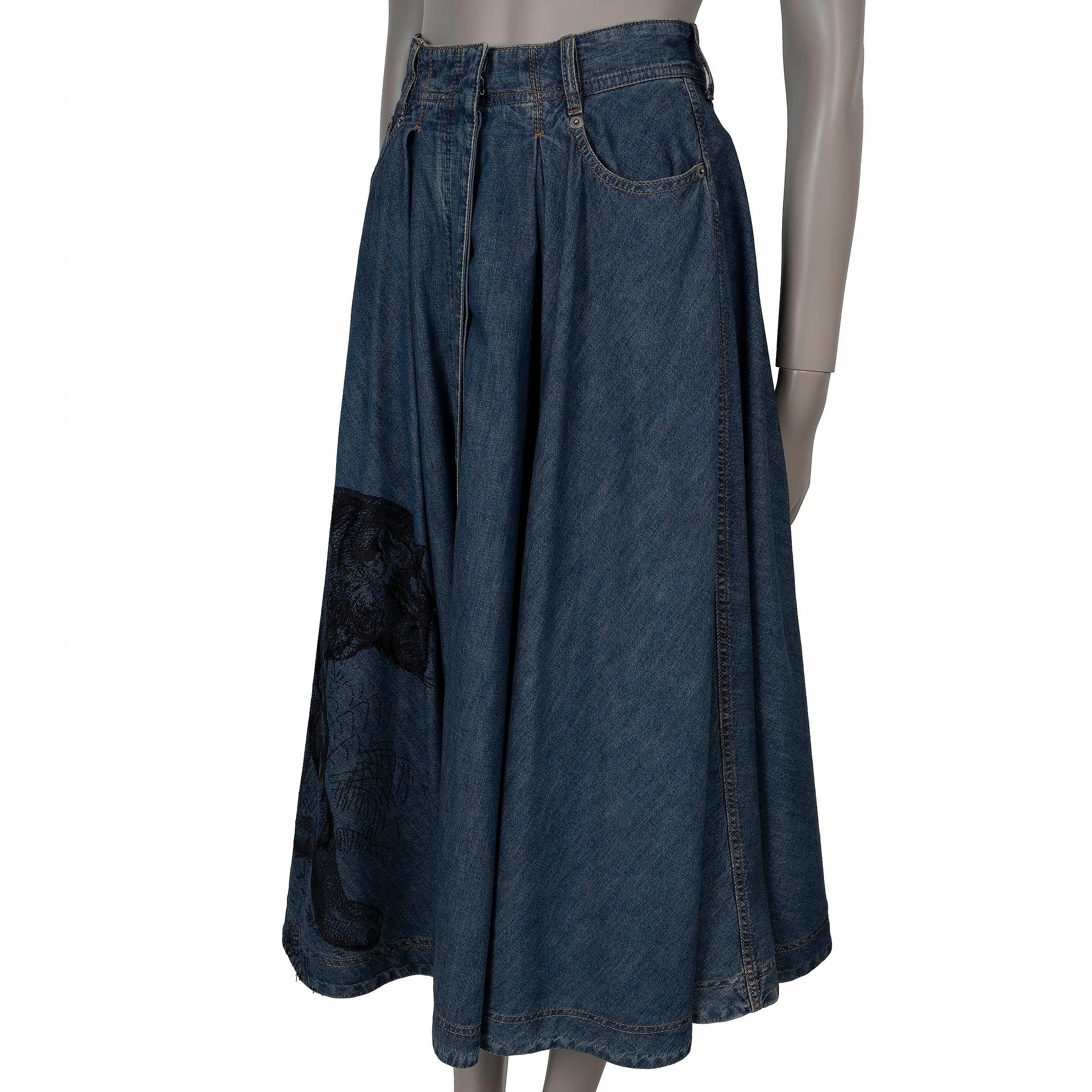 This 100% authentic Christian Dior Macro Toile De Jouy denim skirt in blue cotton showcases an artistic black panther print, partially embroidered for added texture and depth. Designed with a flared, midi silhouette, it features a classic