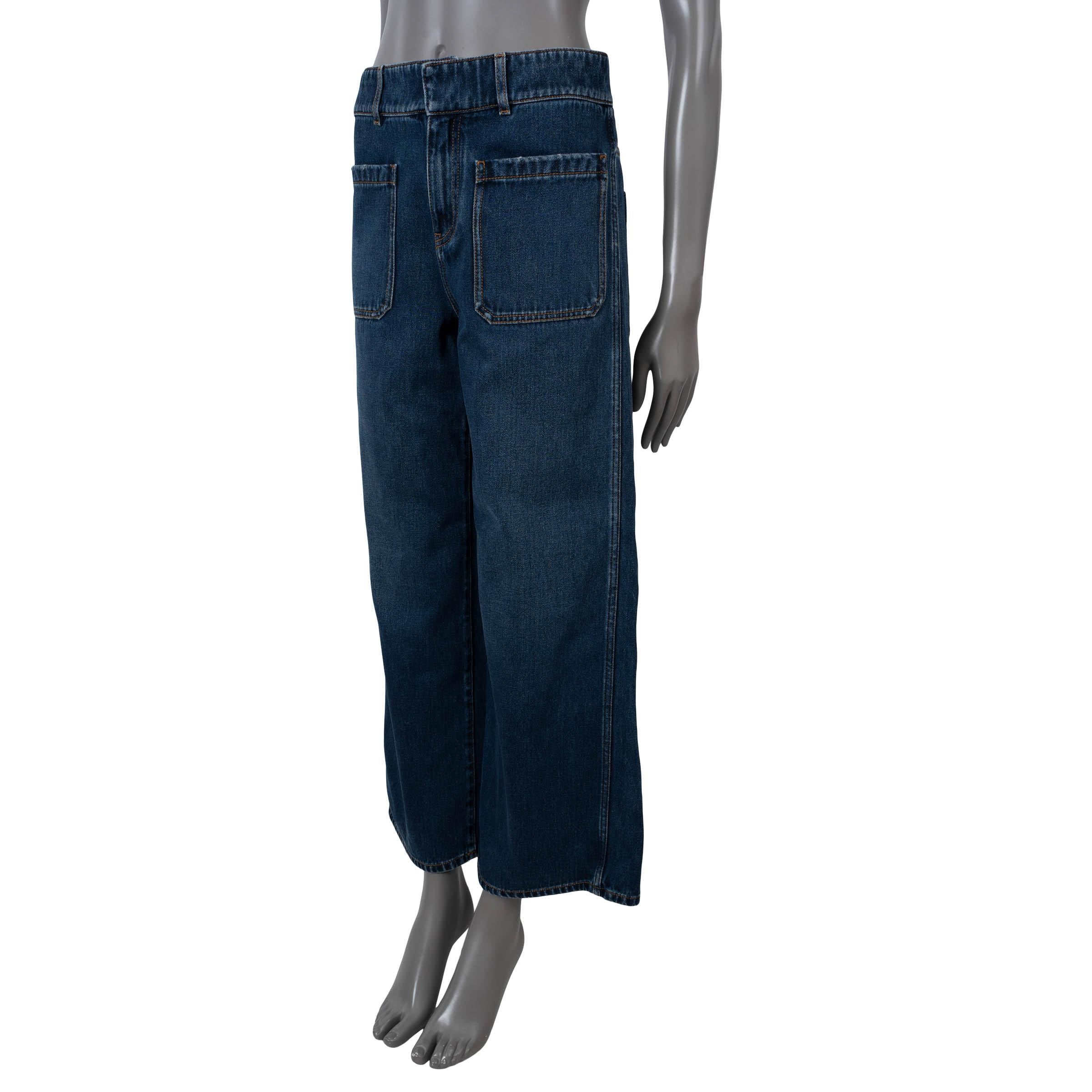 100% authentic Christian Dior flared jeans in deep blue denim cotton (100%). Features two patch pockets on the front and two on the back, belt loops and Christian Dior Paris signature band on the interior. Close with a concealed hook and zipper.
