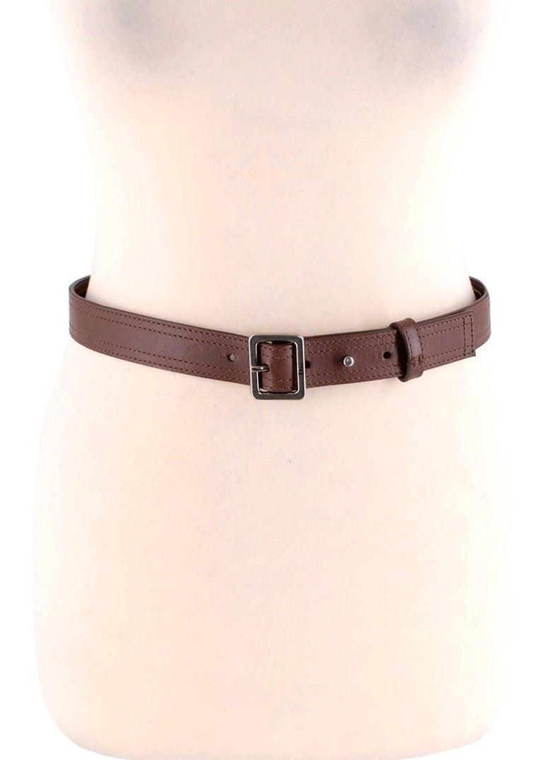Christian Dior Deep Brown Leather Narrow Belt

- Squared single-pin buckle
- Silver-tone hardware
- Double-stitched detail

Material: 100% Calf Leather

Made in Italy

PLEASE NOTE, THESE ITEMS ARE PRE-OWNED AND MAY
SHOW SIGNS OF BEING STORED EVEN