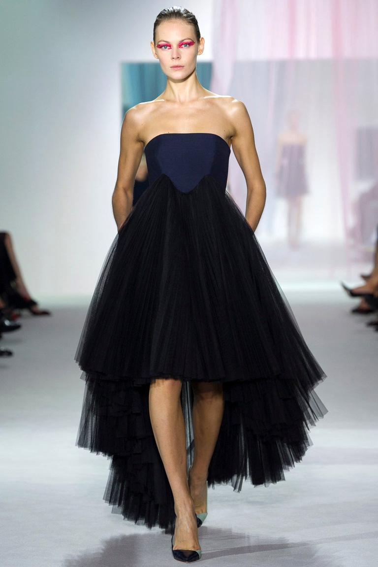 Christian Dior 2013 by Raf Simons offers a current simple and elegant iconic shape.   His styles offer a quiet and stylish elegance with inspiration drawn from House of Dior archives.    A winning combination.

Runway strapless evening dress 