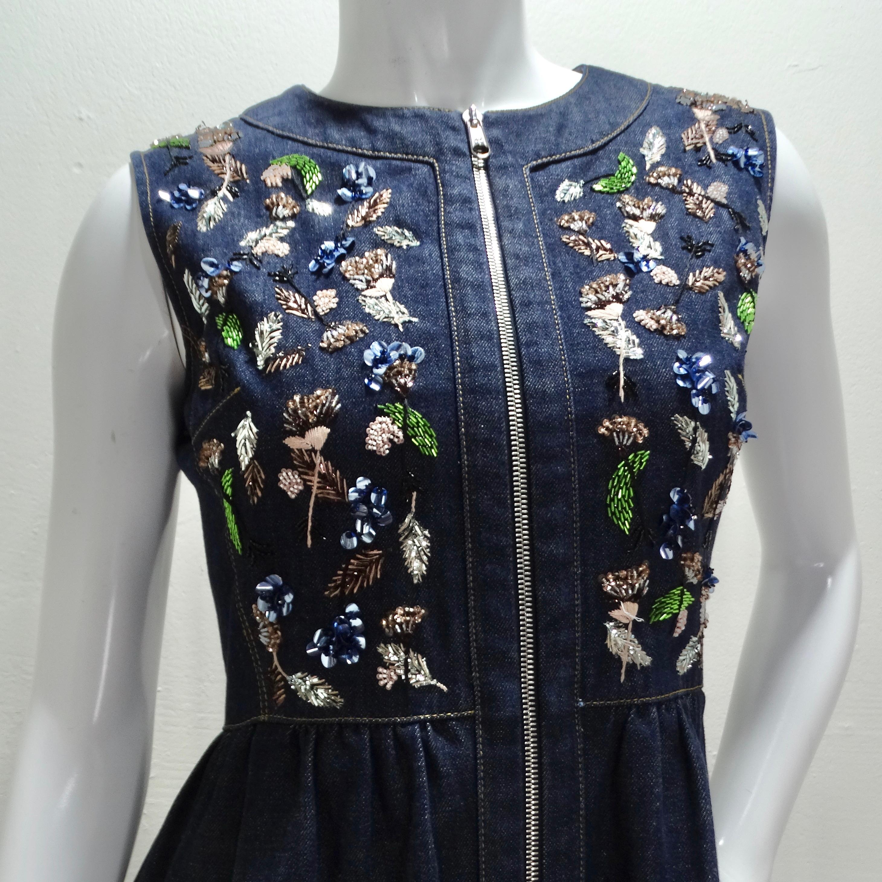 The Christian Dior Denim Embroidered Sleeveless Dress is a stunning and unique piece that combines timeless denim with whimsical floral embroidery, creating a charming statement dress. The sleeveless style adds a touch of modernity to the classic
