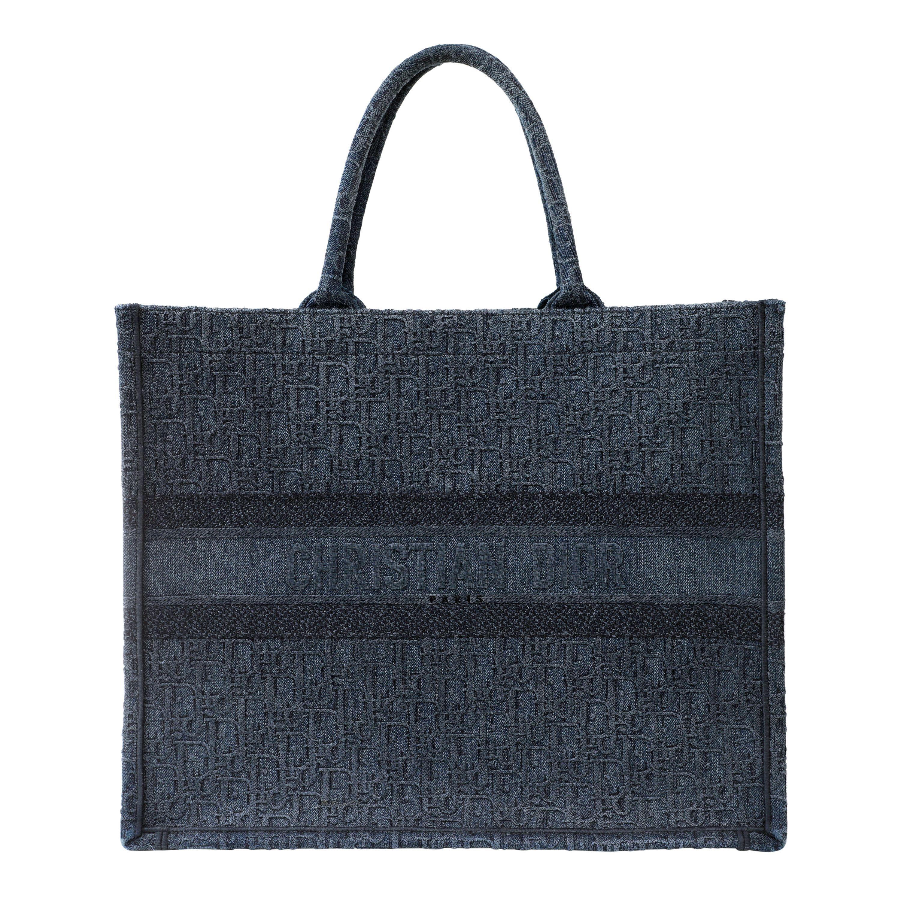 Dior Denim Oblique Large Book Tote- Pristine; appears never carried.
Dark blue denim with Dior signature Oblique pattern.  This is the large size; easily carries a fifteen inch laptop in addition to the other daily essentials.  Unlined interior. 