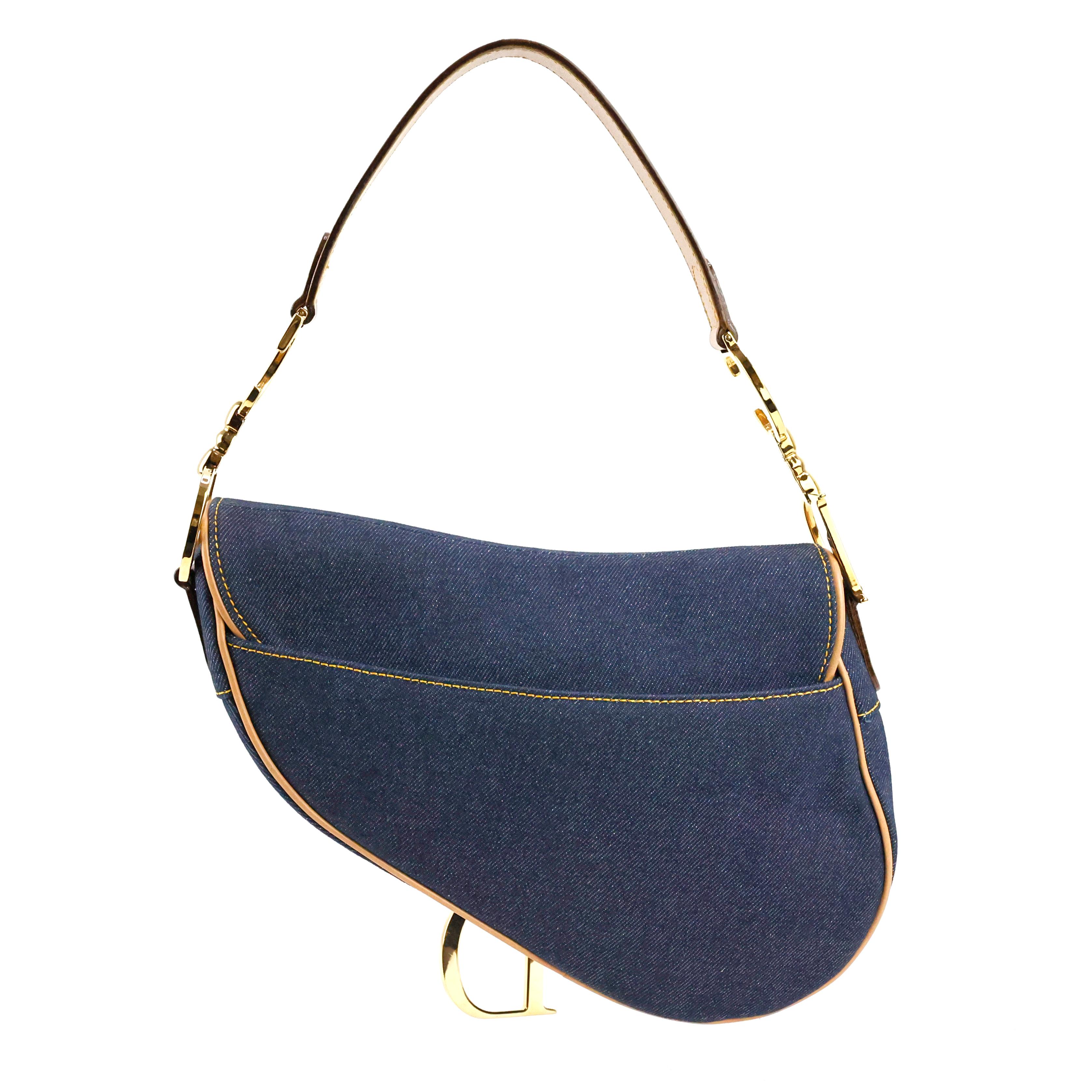 Christian Dior by John Galliano Saddle bag in denim color blue and beige leather, gold hardware. 

Condition: 
Excellent. 

Packing/accessories: 
Box, dustbag and authenticity card.

Measurements:
24cm x 18cm x 5cm