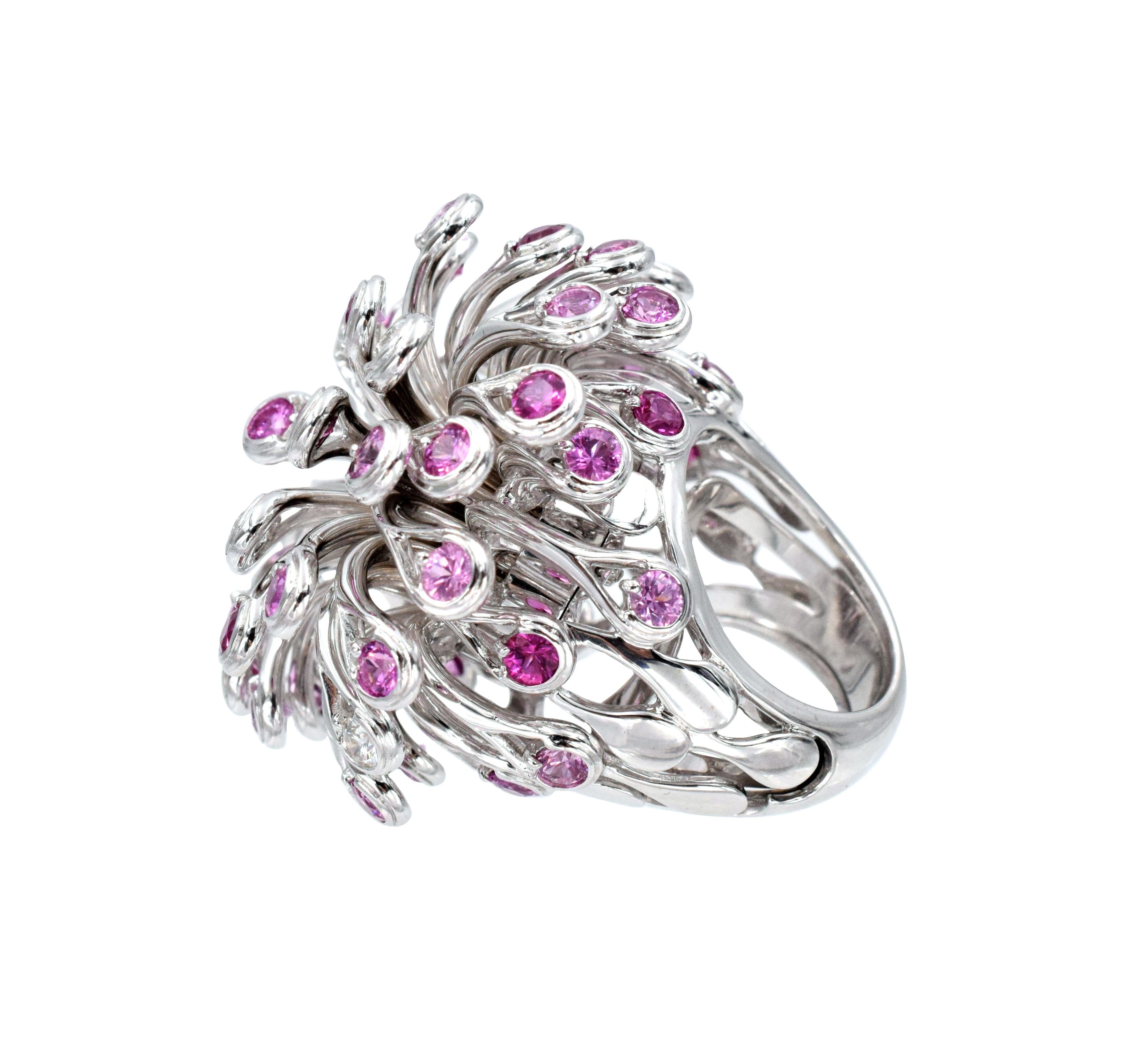 Christian Dior Diamond and Pink Sapphire Ring. This ring has approximately 0.6ct of round brilliant diamonds and approximately 7.5ct of pink sapphires all set in 18k white gold. Signed Dior, 750, E8797. Weight: 59.7g. Ring size: 6.25