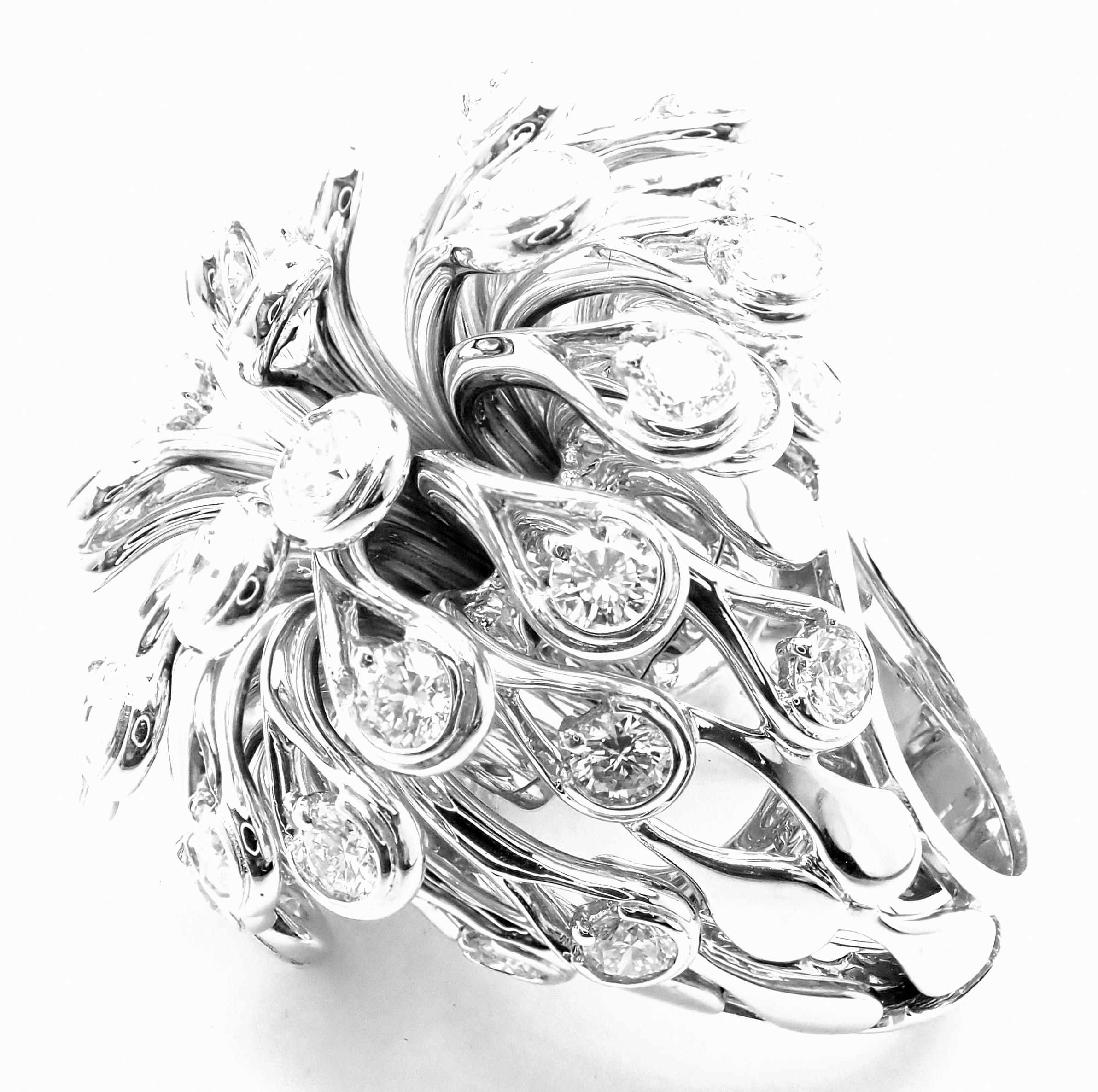 18k White Gold Large Flower Diamond Ring by Christian Dior. 
With Round brilliant round cut diamonds VVS1 clarity, E color total weight approx. 6.50ct
Details: 
Size: European 53, US 6 1/4
Weight: 58 grams
Width: 37mm
Stamped Hallmarks: Dior 750 53