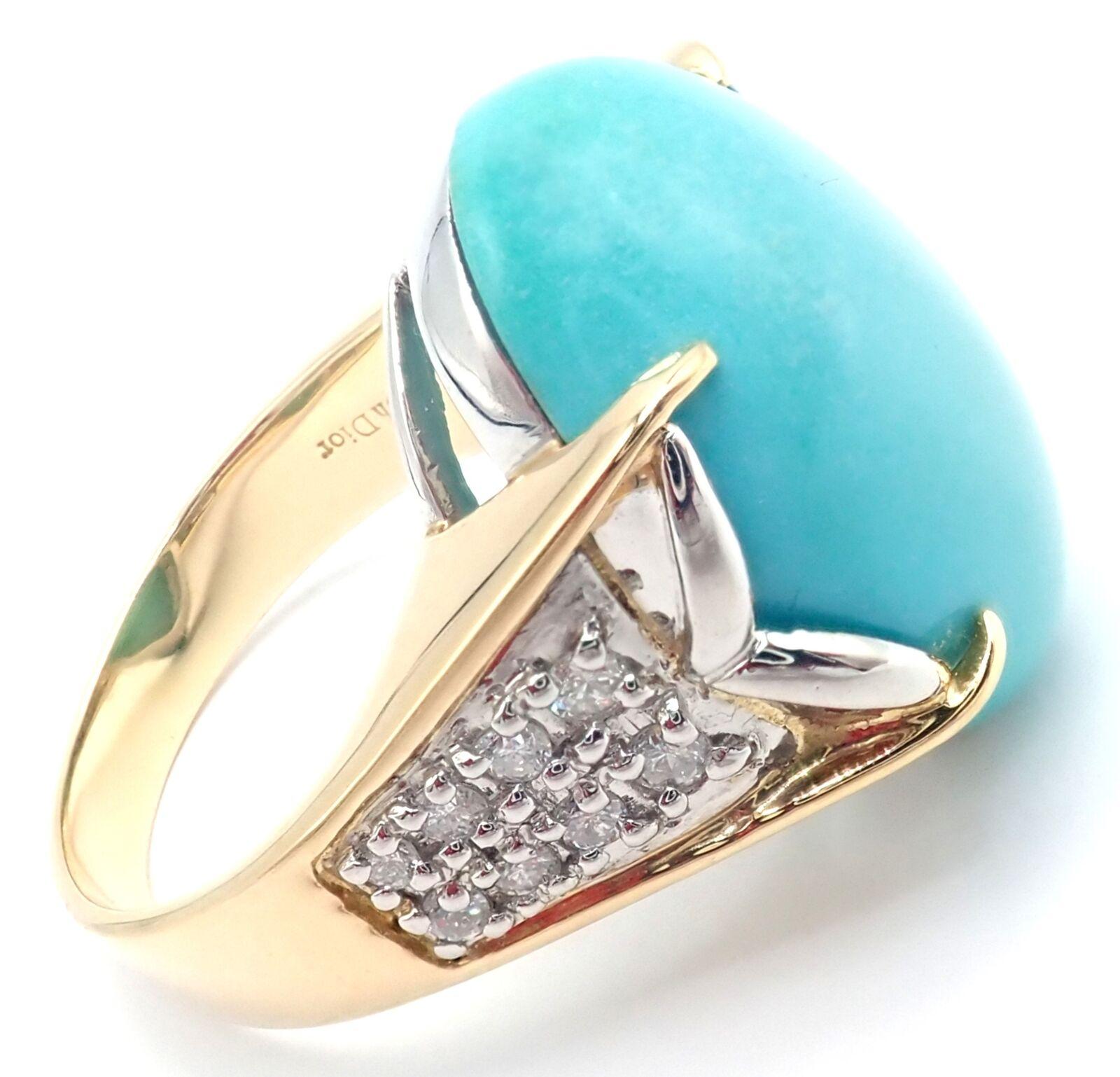 18k Yellow Gold and Platinum Diamond Large Turquoise Ring by Christian Dior. 
With 16 round brilliant cut diamonds VS1 clarity, E color total weight approx. .31ct
1 large oval turquoise stone 20mm x 15mm
Details: 
Size: 6 3/4
Width: 20mm
Weight: