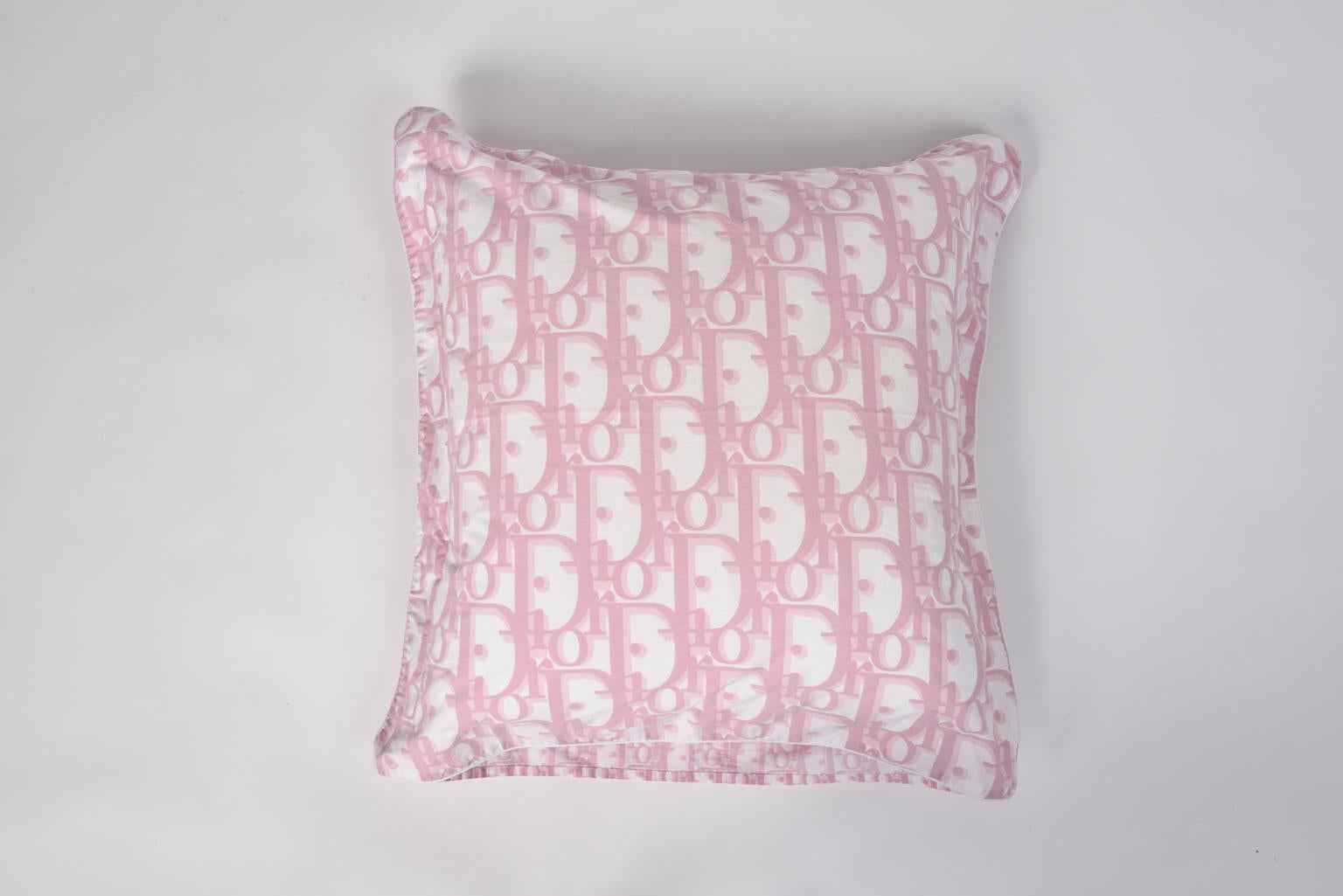 Have a pink restful sleep with this rare Christian Dior pillow case. Made of high quality cotton, one side of the cover features the oversized iconic 