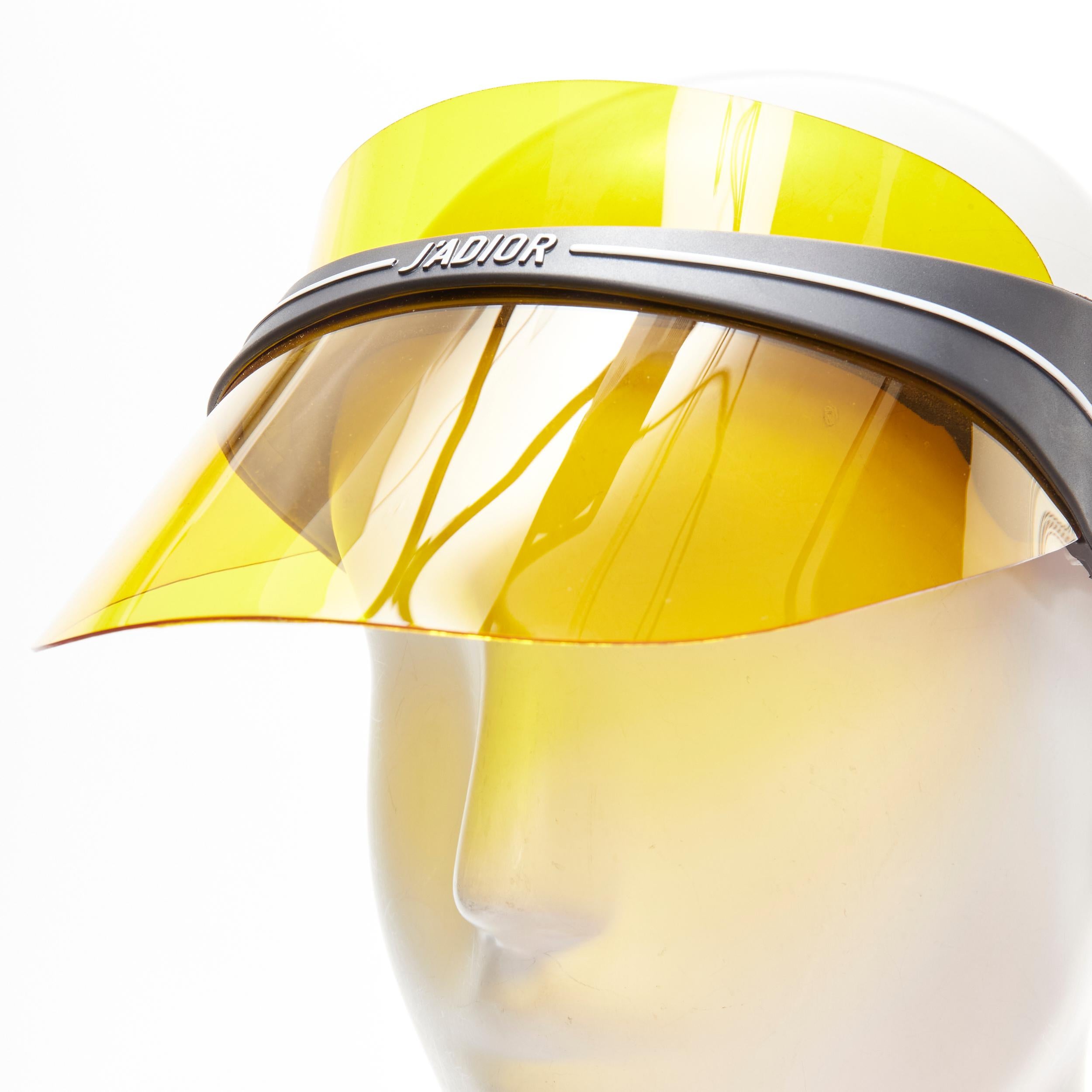 CHRISTIAN DIOR DiorClub1 Signature yellow visor shield hat 
Reference: LNKO/A01983 
Brand: Christian Dior 
Material: Plastic 
Color: Yellow 
Pattern: Solid 
Extra Detail: Adjustable elasticated logo strap 
Made in: Italy 


CONDITION: 
Condition: