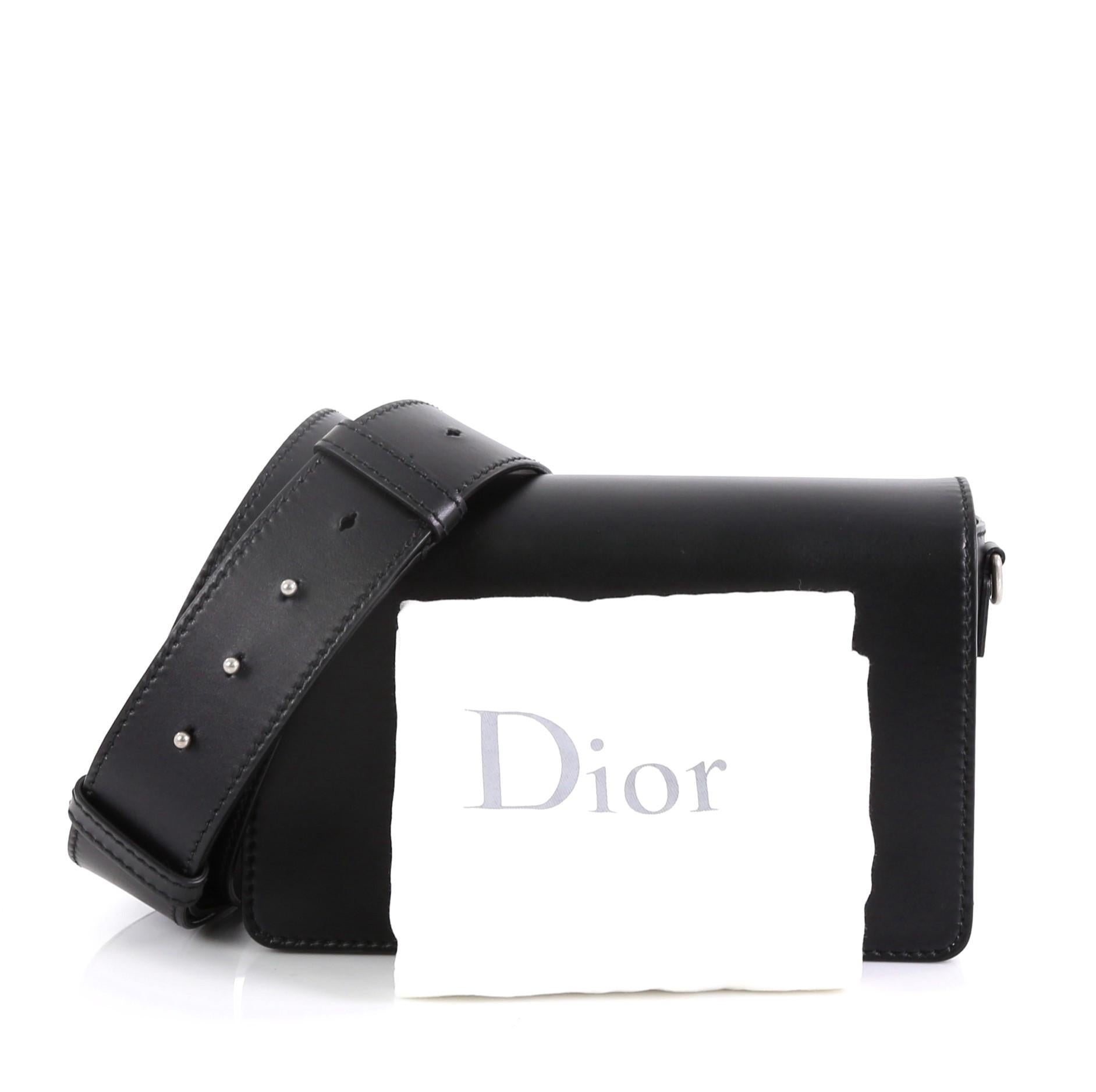 This Christian Dior Dio(r)evolution Flap Bag Leather Medium, crafted from black leather, features a slot handclasp with DIOR emblem and silver-tone hardware. It opens to a black suede interior with zip pocket. 

Estimated Retail Price: