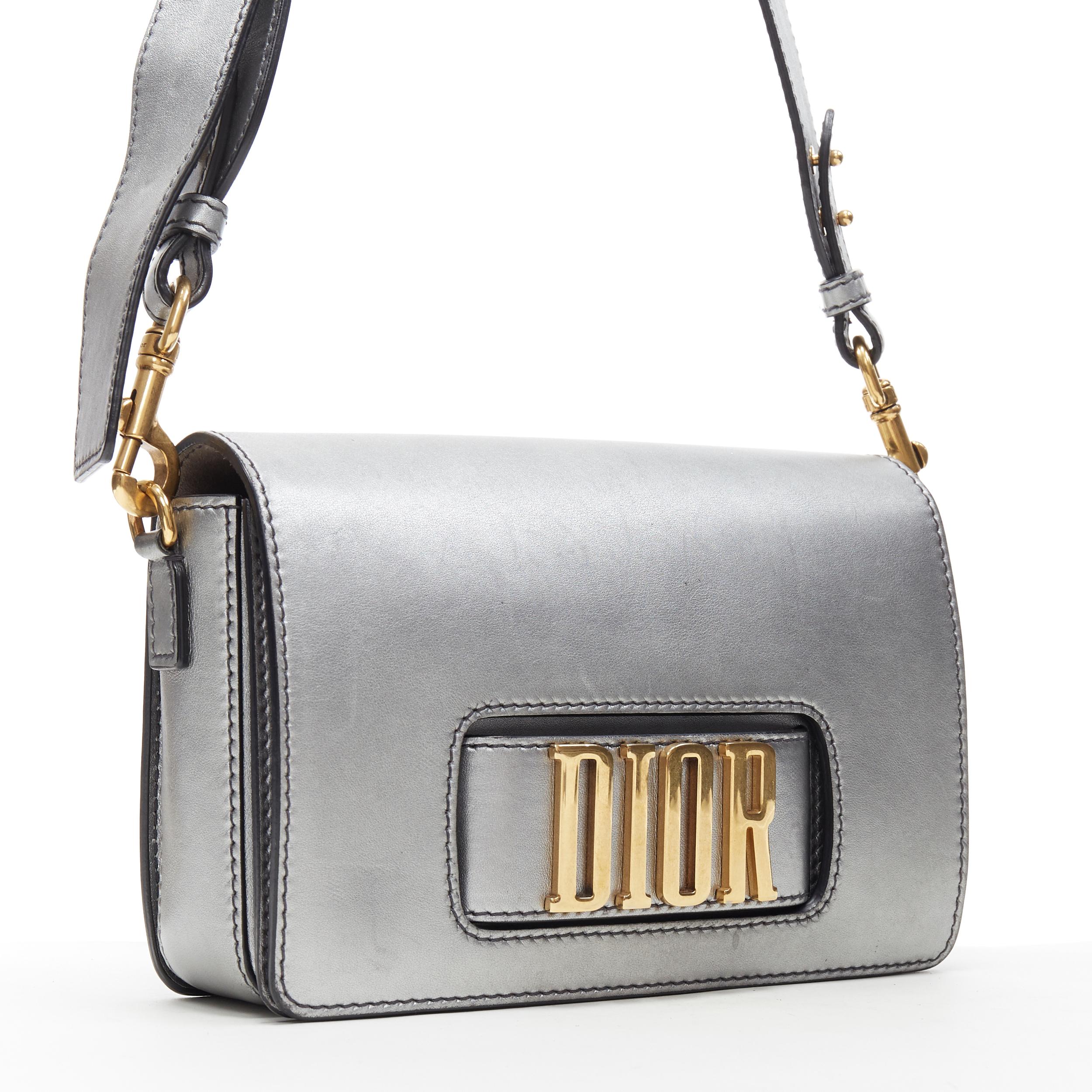 CHRISTIAN DIOR Dio(r)evolution silver leather gold logo strap flap crossbody bag
Brand: Christian Dior
Model Name / Style: Dio(r)evolution bag
Material: Leather
Color: Silver
Pattern: Solid
Closure: Magnetic
Extra Detail:
Made in: Italy

CONDITION: