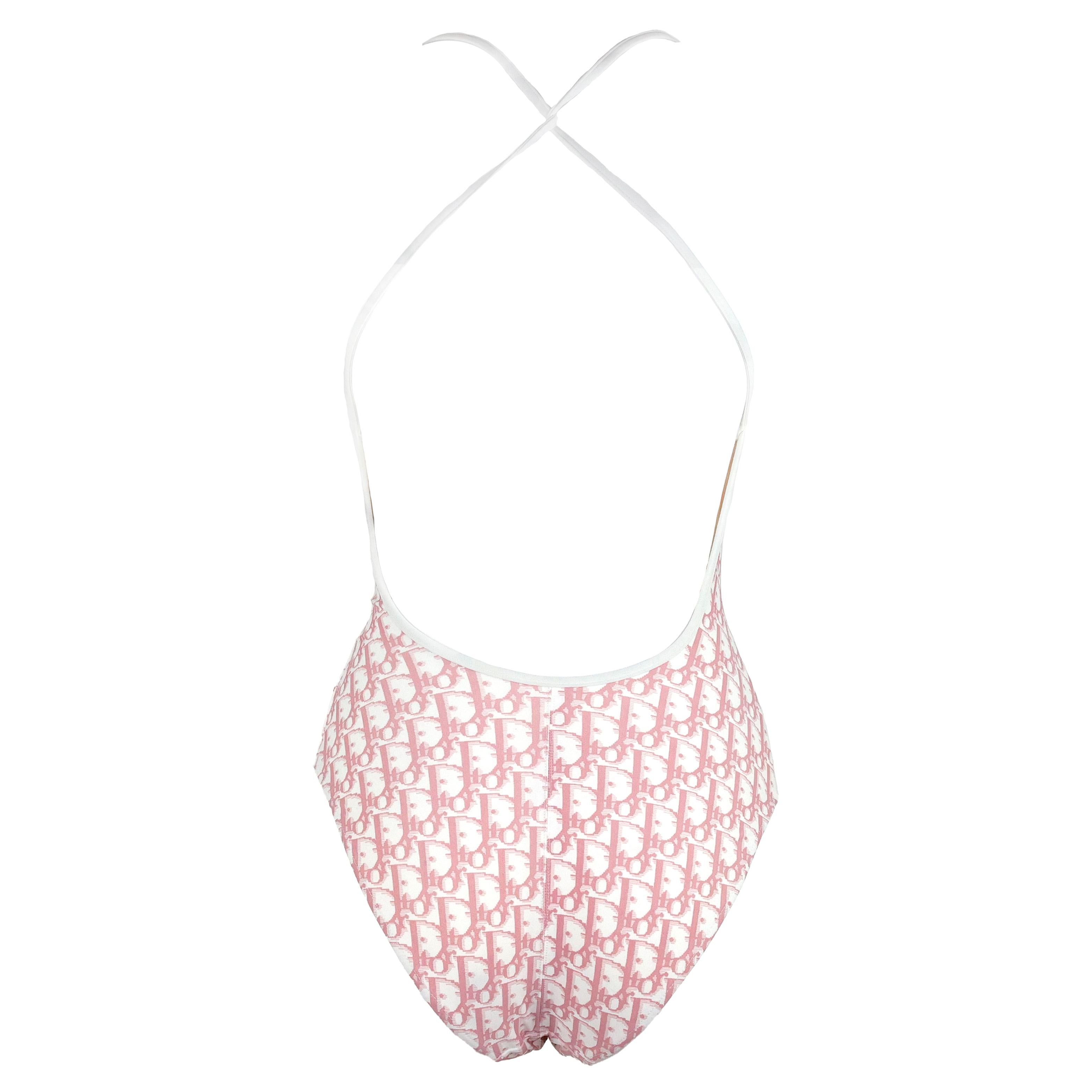 Rare Christian Dior by John Galliano Diorissimo Girly Floral Embellished one-piece swimsuit in pink oblique monogram with crystal embellished Dior logo, size 85C (fits international an small/medium).

Condition:
Excellent.