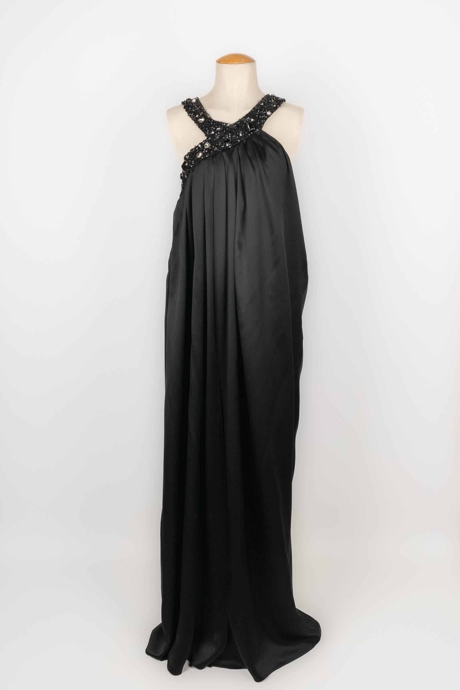 DIOR - (Made in France) Black silk dress embroidered with rhinestones. Size 44FR indicated. 2008 Resort Collection, under the artistic direction of John Galliano.

Condition:
Very good condition

Dimensions:
Chest: 50 cm - Length: 150 cm

SKU:VR309