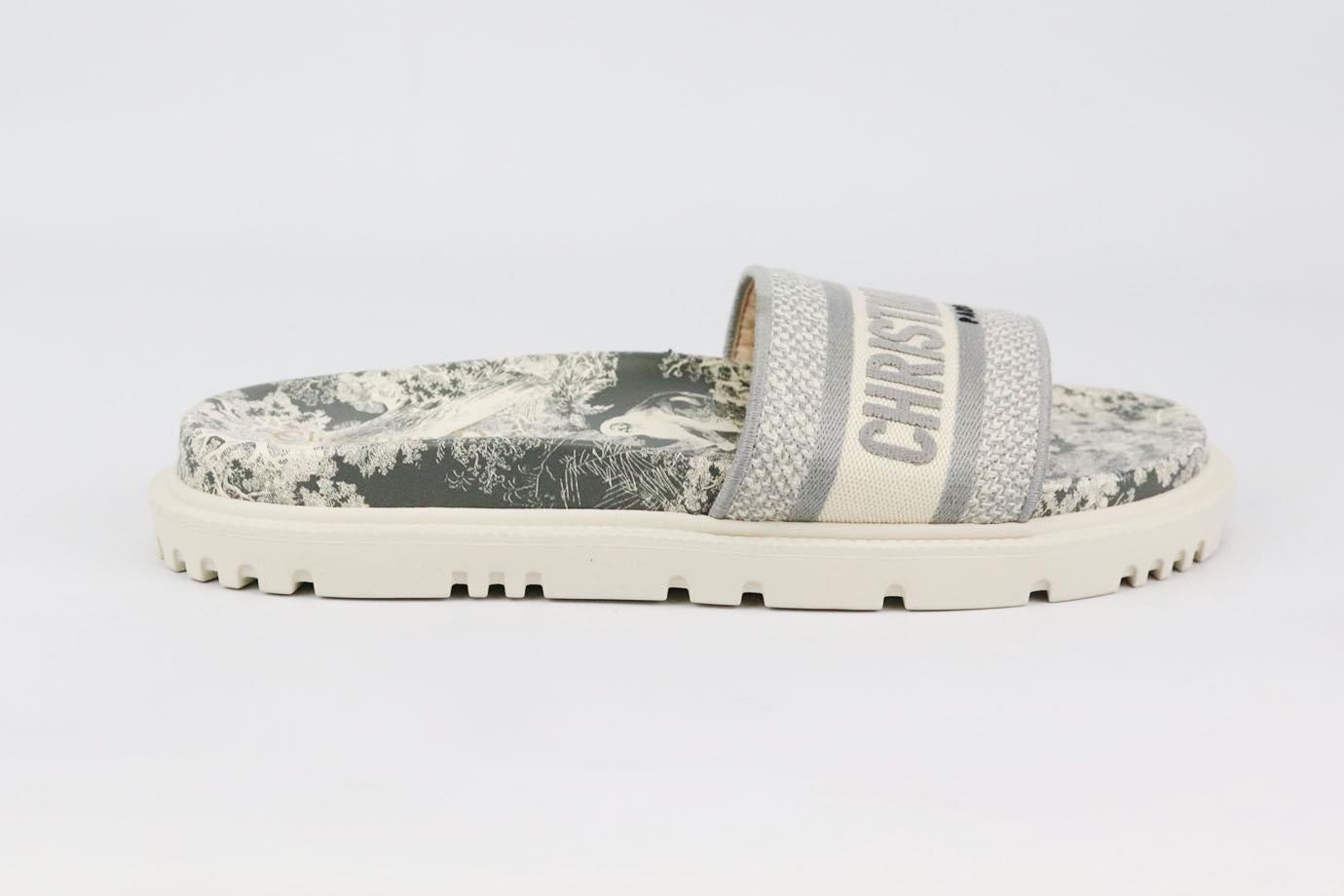These ‘DWay’ slides by Christian Dior are everything you'd want in a summer pair - they're comfortable, stylish and endlessly versatile, made in Spain with grey and white Toile de Jouy print and matching logo embroidered cotton band across the