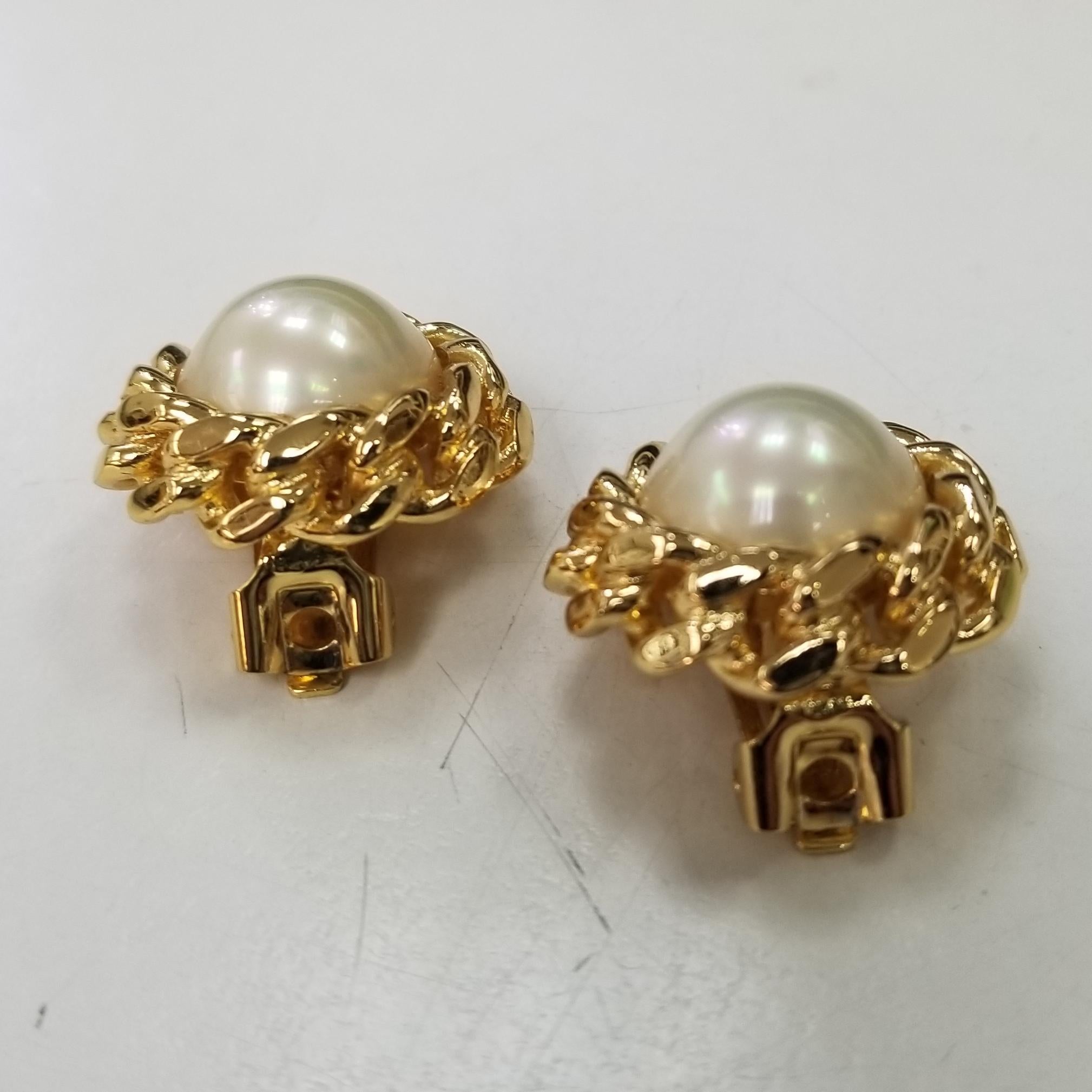 A large statement pair of vintage Christian Dior earrings. Gold tone and faux pearl, excellant condition signed and authentic.