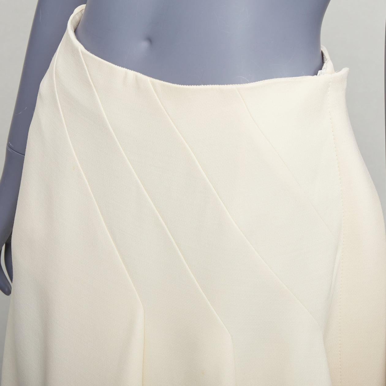CHRISTIAN DIOR ecru  cream wool silk bias cut pleated Aline skirt FR38 M
Reference: GEGG/A00191
Brand: Dior
Designer: Maria Grazia Chiuri
Material: Wool, Silk
Color: Cream
Pattern: Solid
Closure: Zip
Lining: Cream Silk
Extra Details: Side zip.
Made