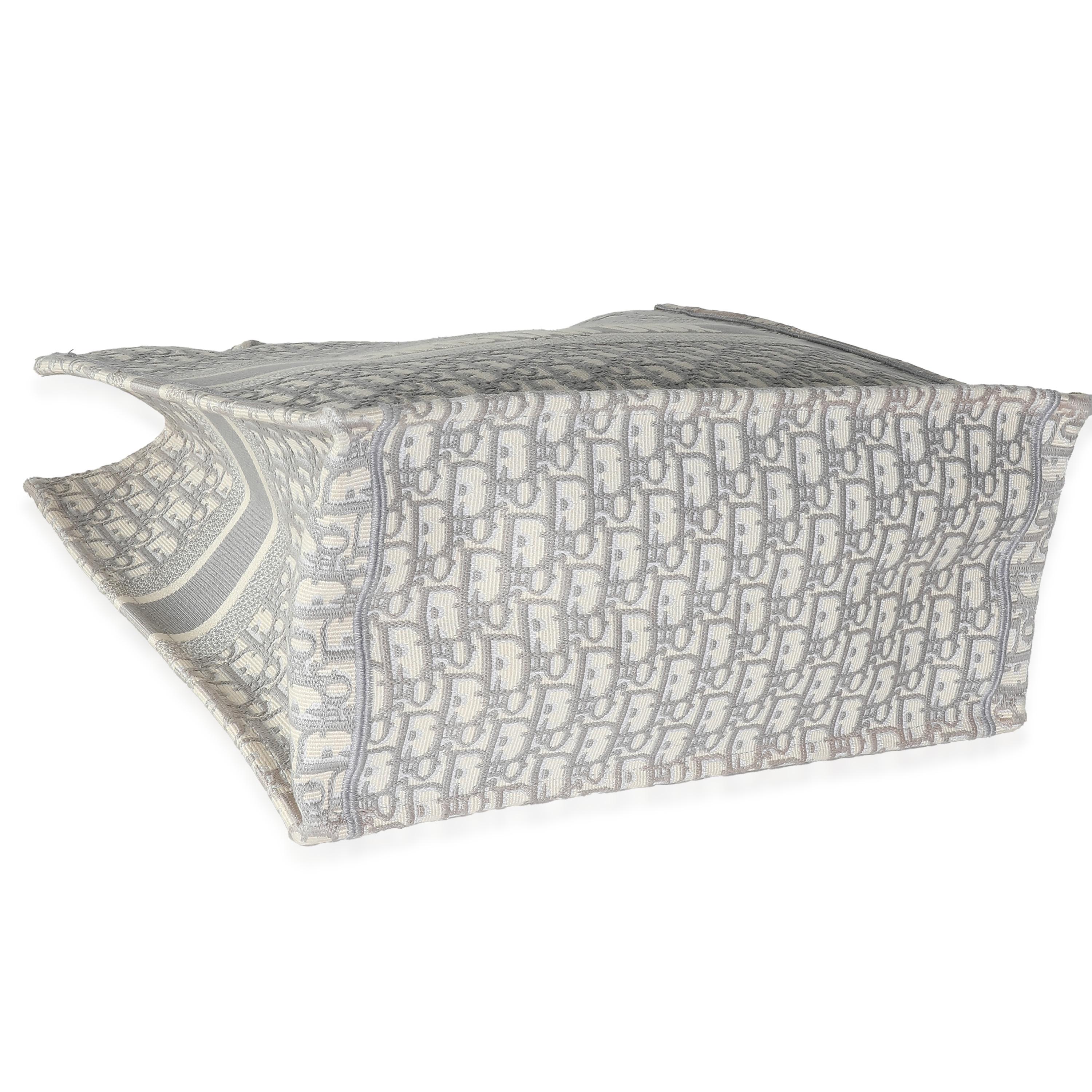 Listing Title: Christian Dior Ecru Gray Oblique Jacquard Large Book Tote
SKU: 139418
MSRP: 3500.00 USD
Condition: Pre-owned 
Condition Description: The Dior Book tote combines practicality with impeccable style. Embroidered throughout for a look