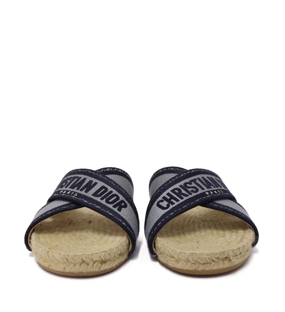 Christian Dior Granville Espadrille Slide in Blue.

Material: Canvas.
Size: EU 38.5
Overall Condition: Good
Interior Condition: Discoloration
Exterior Condition:  Signs of use