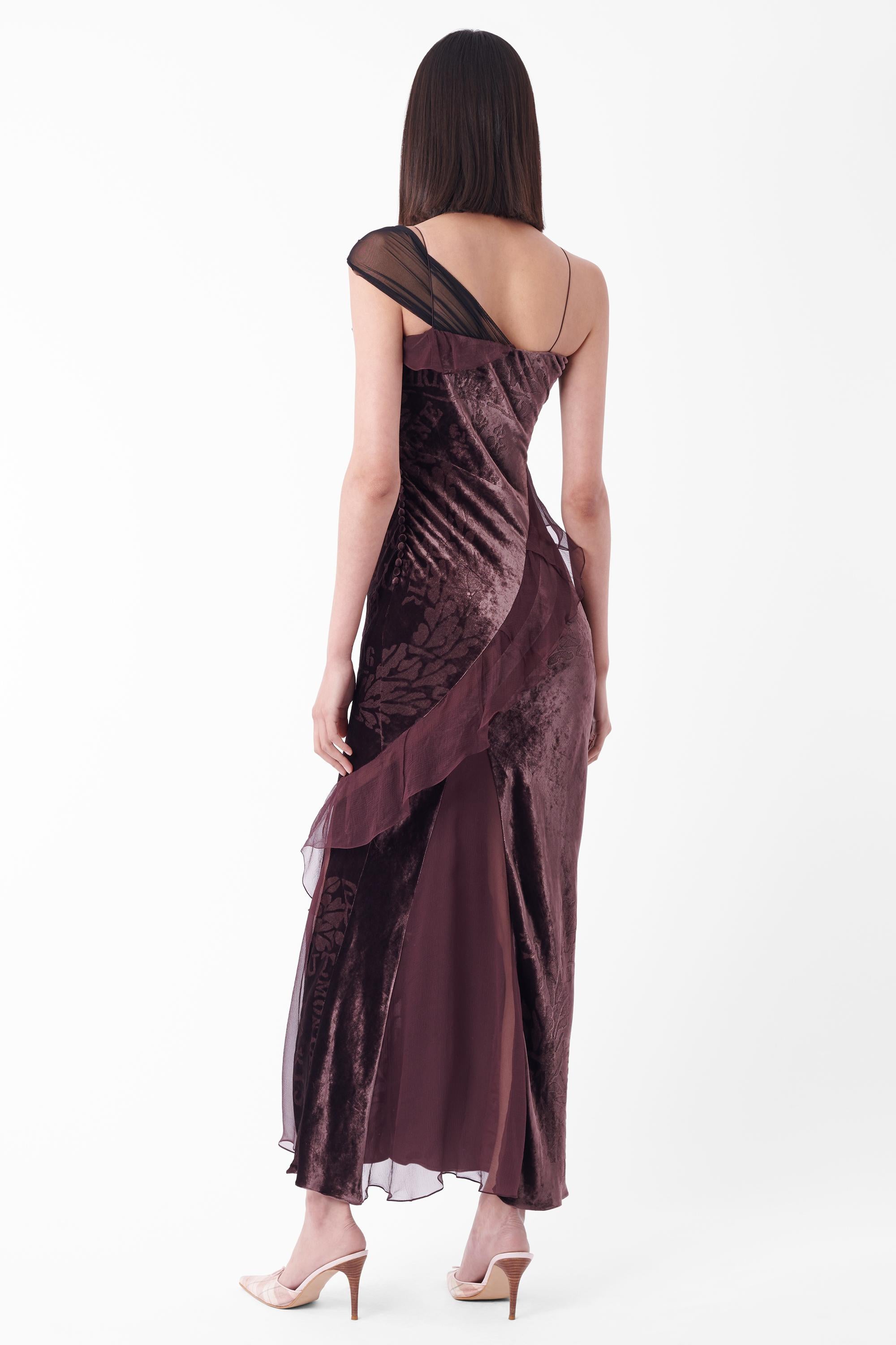 We are excited to present this amazing Christian Dior Fall Winter 2006 gown, as seen on the runway. Features skinny straps, one sided mesh shoulder panel, ruffling detail running asymmetrically down the dress, velvet body with print and classic Dior