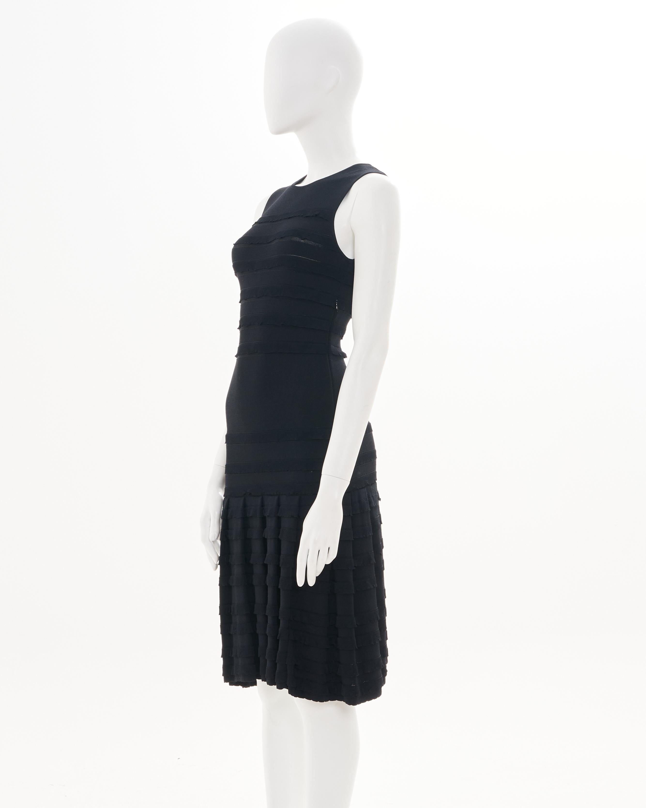 - Designed by Bill Gaytten
- F/W 2012
- Midi Length
- Black Layered Details
- Sleeveless
- Delicate flared skirt toward hemline
- Excellent Condition
- Size: FR 34 - IT38 - UK 6 - US 2
- Materials: 79% Viscose 19% Polyamide 2% Elasthan
- Made in