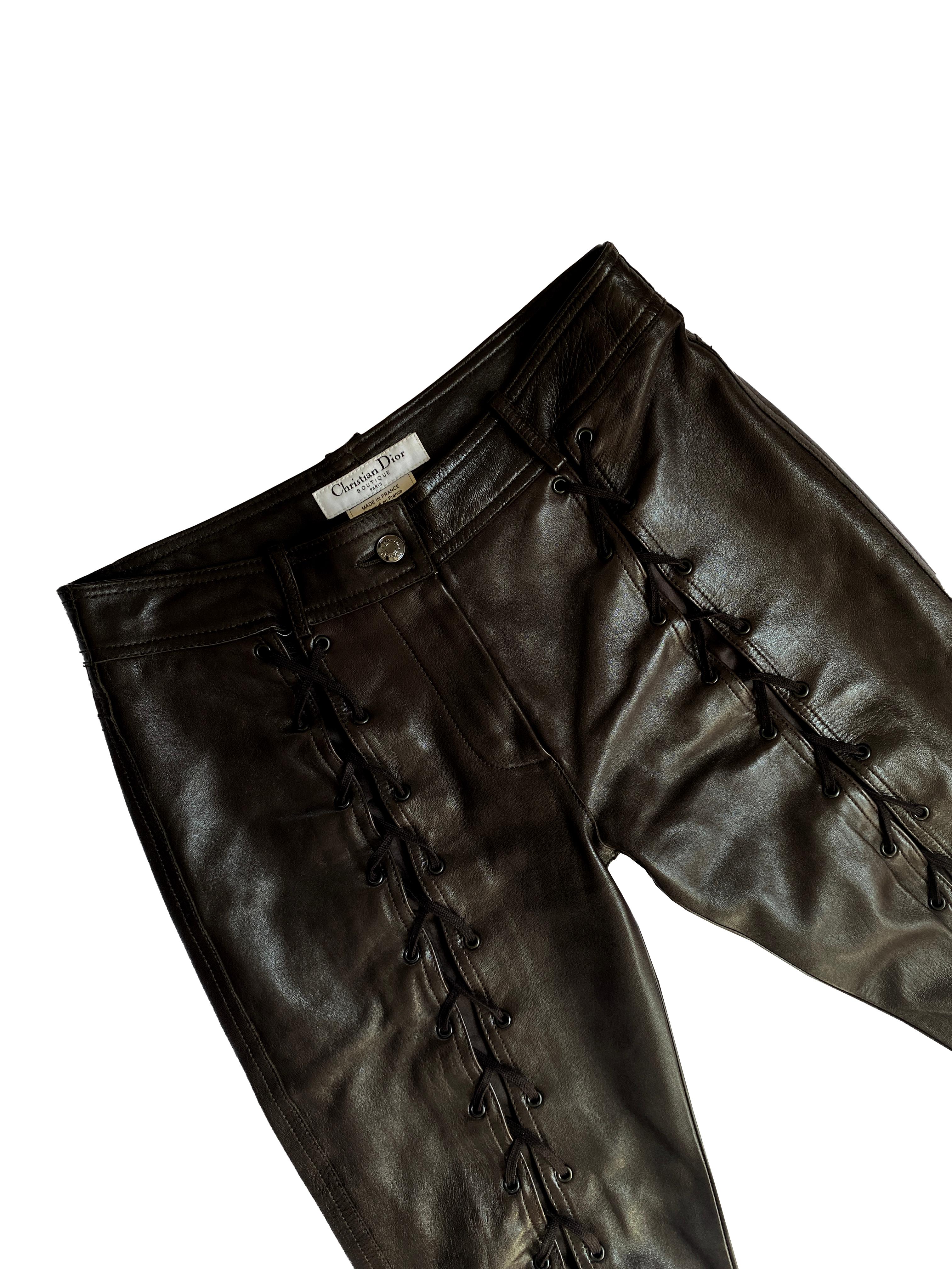 Christian Dior by John Galliano Fall 2003 famous lace up leather pants in black. Wear the laces as tight or loose as you wish which will affect how much skin you show! Wrap around the leg straps with buckles.
Silver hardware

FR 38 - US 6
100%