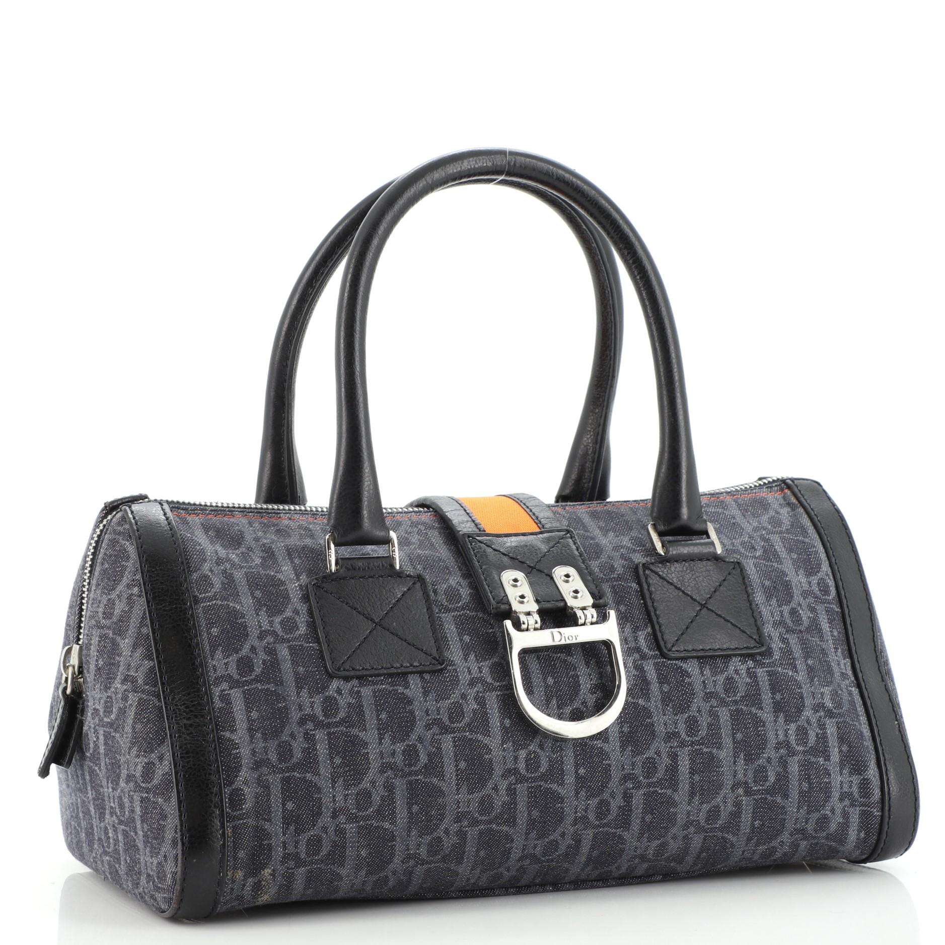 Condition: Good. Moderate wear and glue stains on base and opening corners, scuffs on leather trims. Cracking on handle wax edges, small stain on interior base, scratches and tarnish on hardware.
Accessories: No Accessories
Measurements: Handle Drop