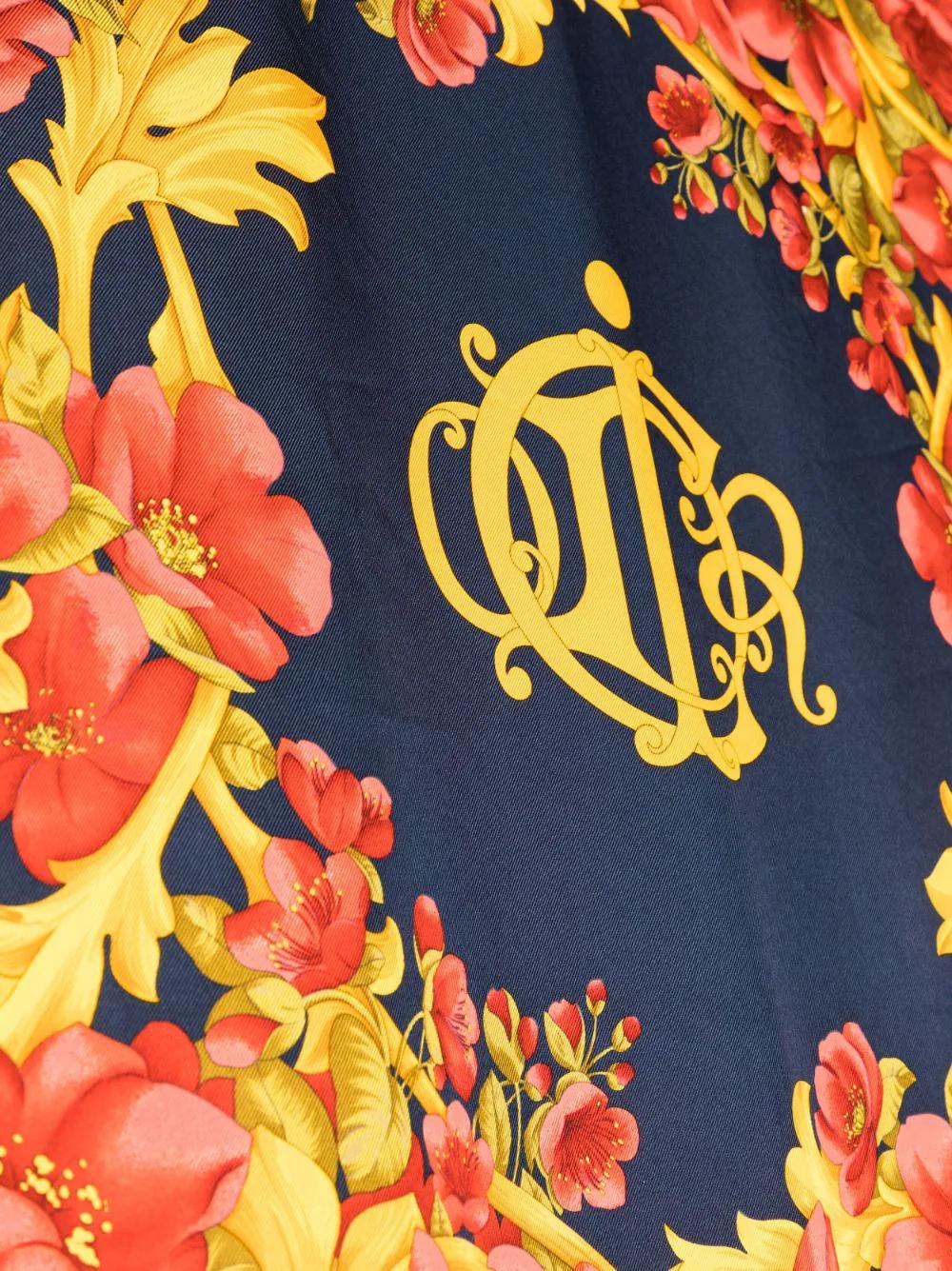 Elevate your look and accessorize with this Christian Dior floral baroque silk scarf. Crafted from luxurious 100% silk, this scarf is a timeless accessory with a finished edge and classic square body. Bring sophistication and refinement to any